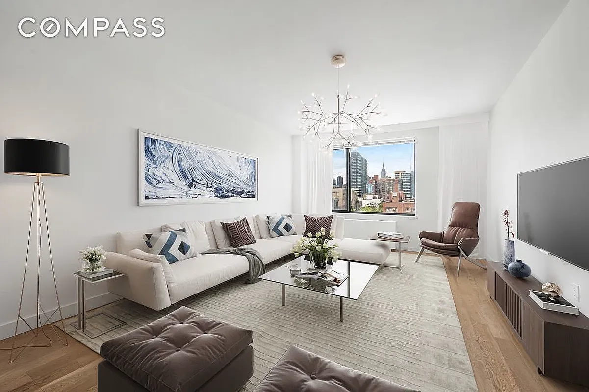 46-09 11th Street, Unit 4H Queens, NY 11101 - Photo 1 of 13 a living room with furniture wooden floor and a flat screen tv