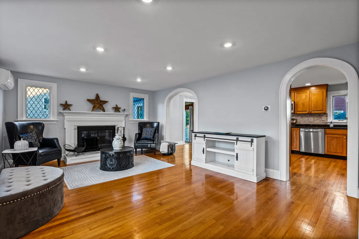 a living room with furniture and a fireplace