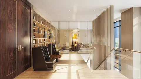 a view of living room with furniture and wooden floor