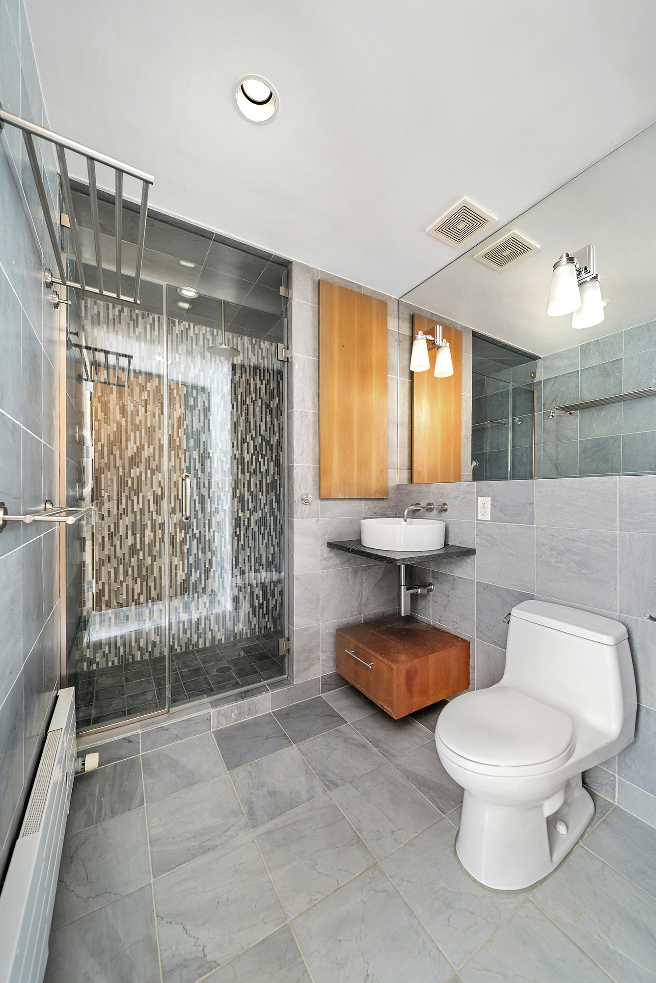 331 East 8th Street, Unit 2 Manhattan, NY 10009 - Photo 9 of 12 a bathroom with a toilet and a shower