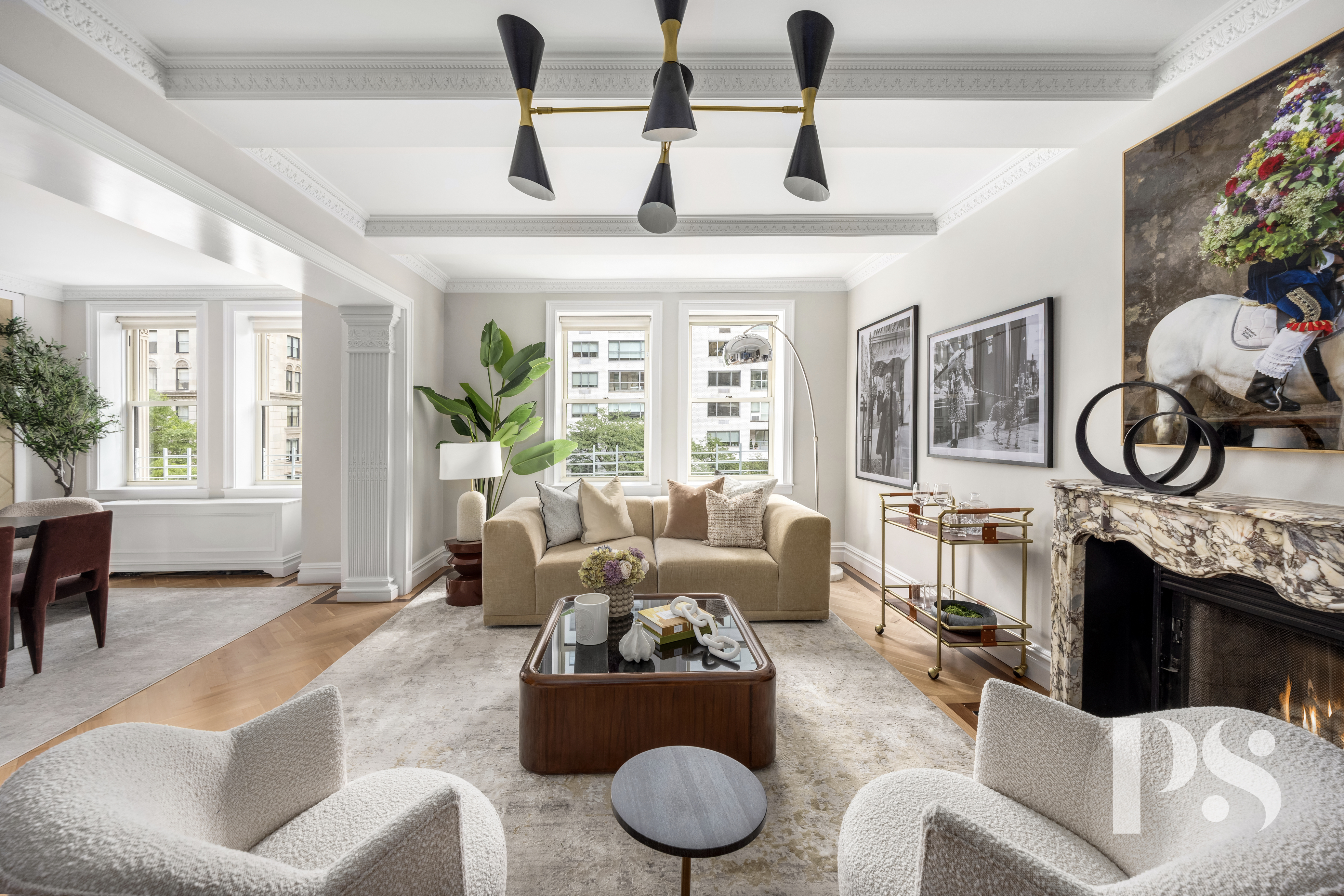 a living room with furniture and a floor to ceiling window