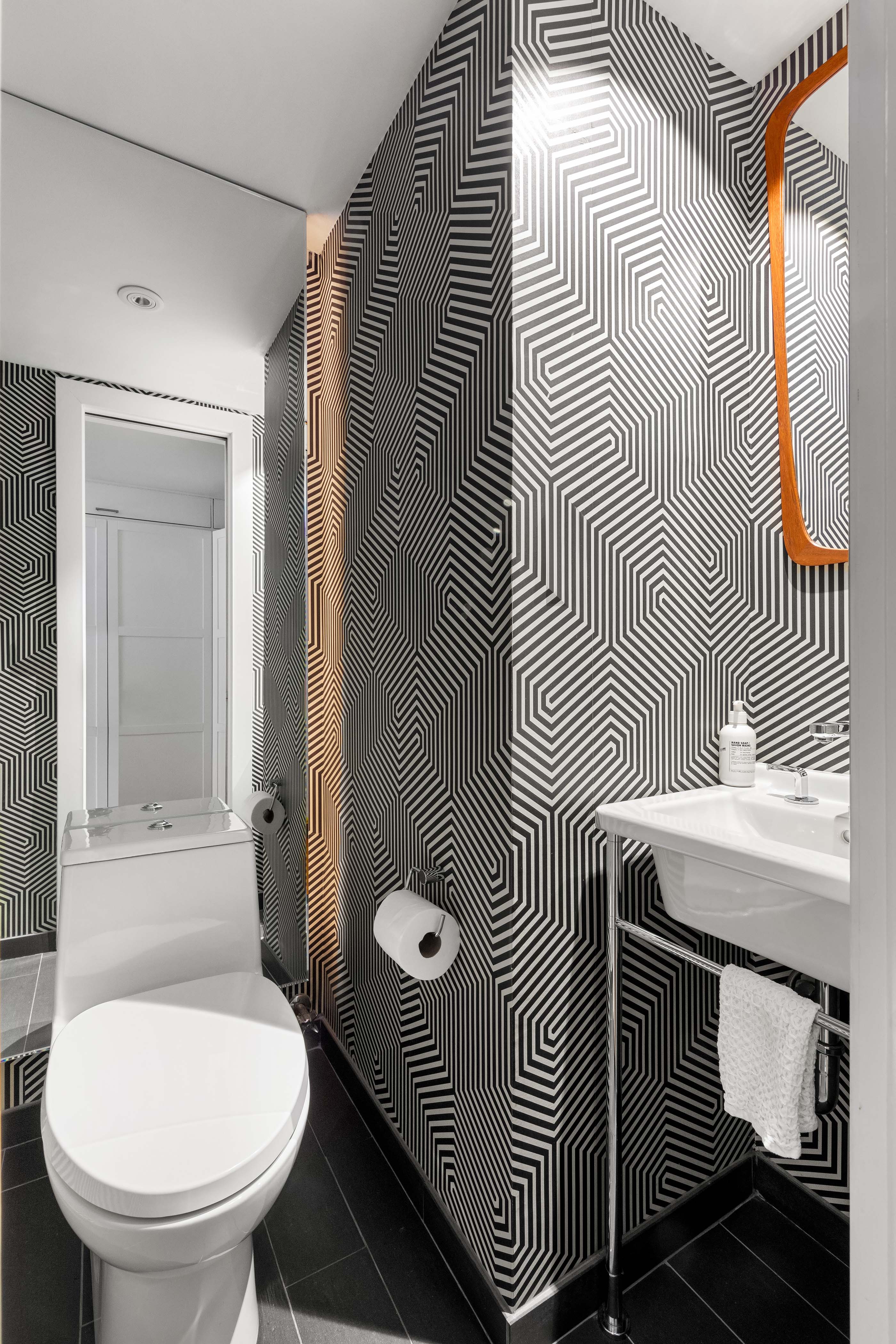 57 Laight Street, Unit 3 Manhattan, NY 10013 - Photo 8 of 15 a bathroom with a sink toilet and mirror