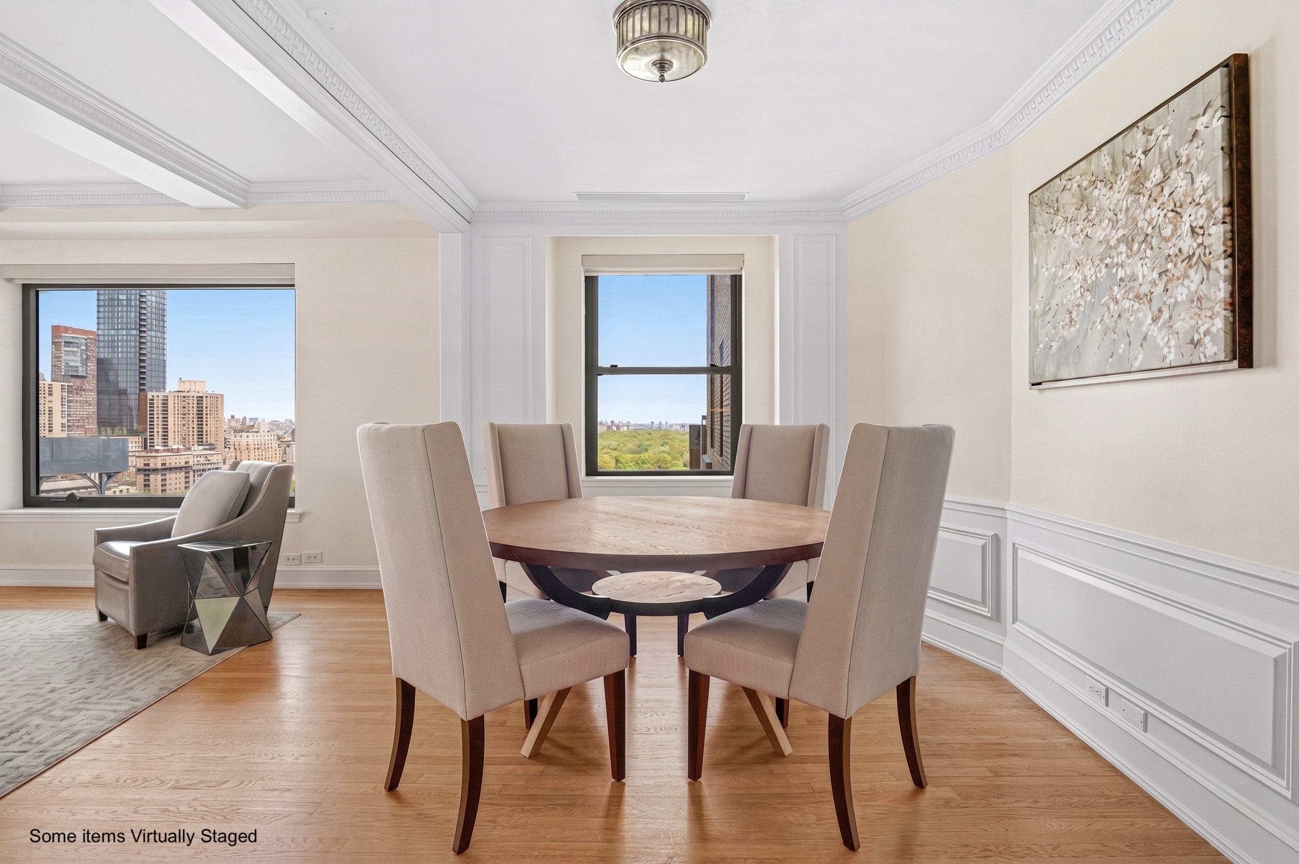 160 Central Park South, Unit 2307 Manhattan, NY 10019 - Photo 4 of 15 a view of a dining room with furniture and wooden floor