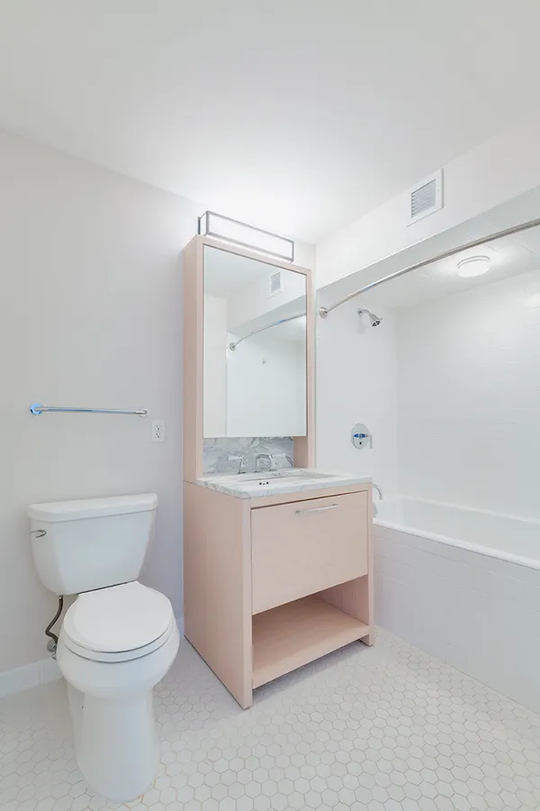 a bathroom with a granite countertop toilet a sink and bathtub