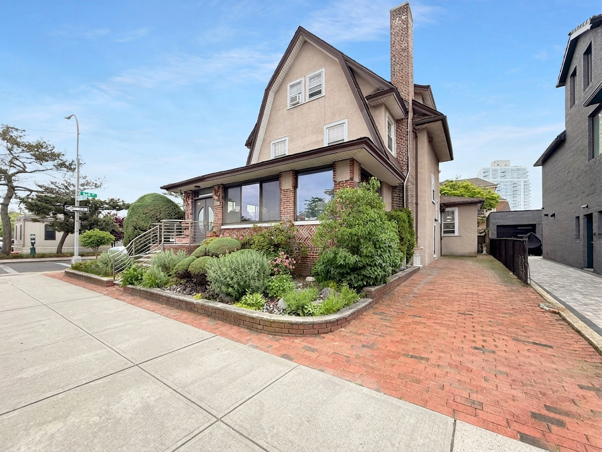 3829 Beach 38th Street Brooklyn, NY 11224 - Photo 6 of 31 a view of a house with a small yard and potted plants