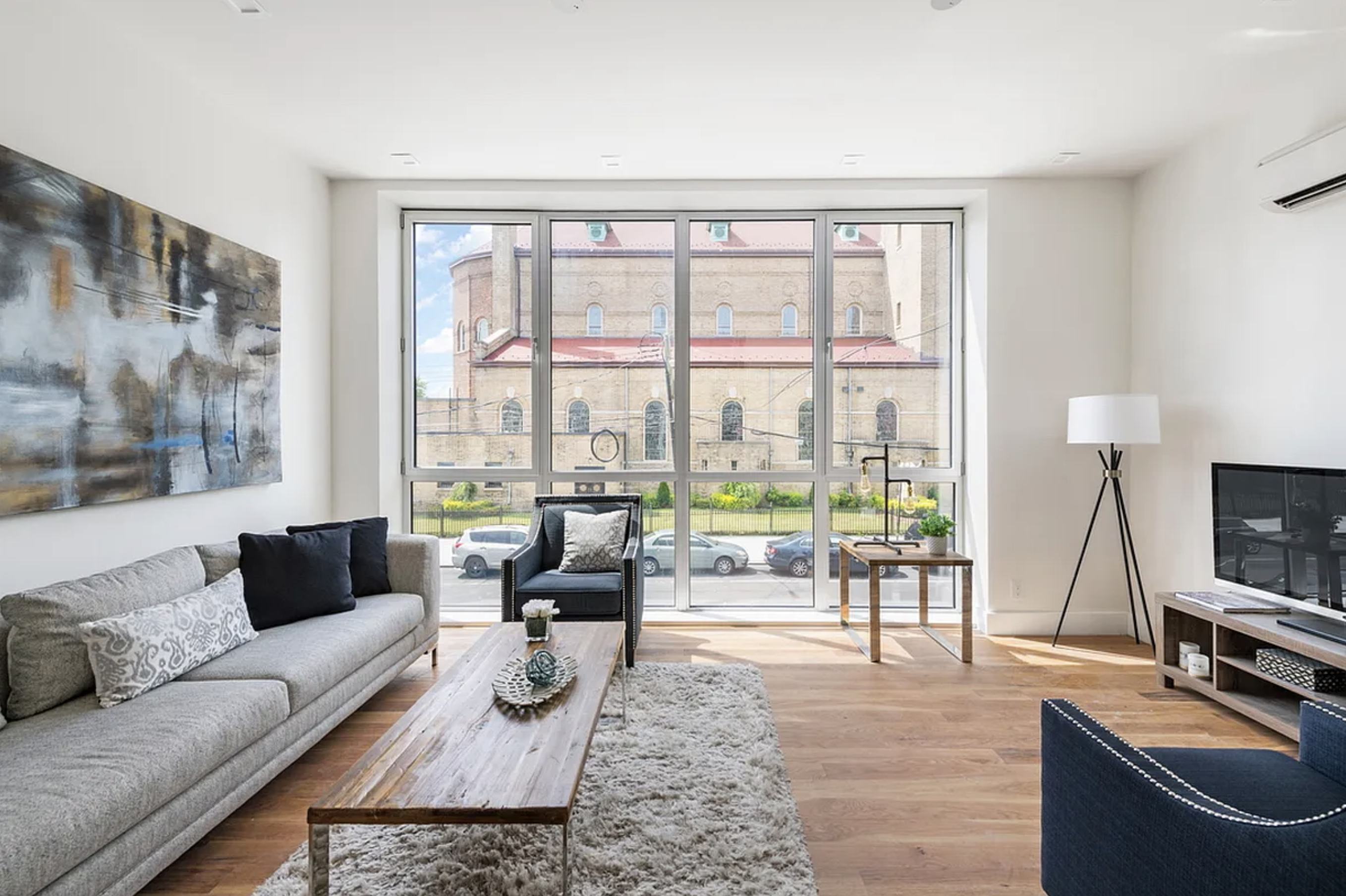 371 Lincoln Road, Unit 2 Brooklyn, NY 11225 - Photo 2 of 19 a living room with furniture and a flat screen tv