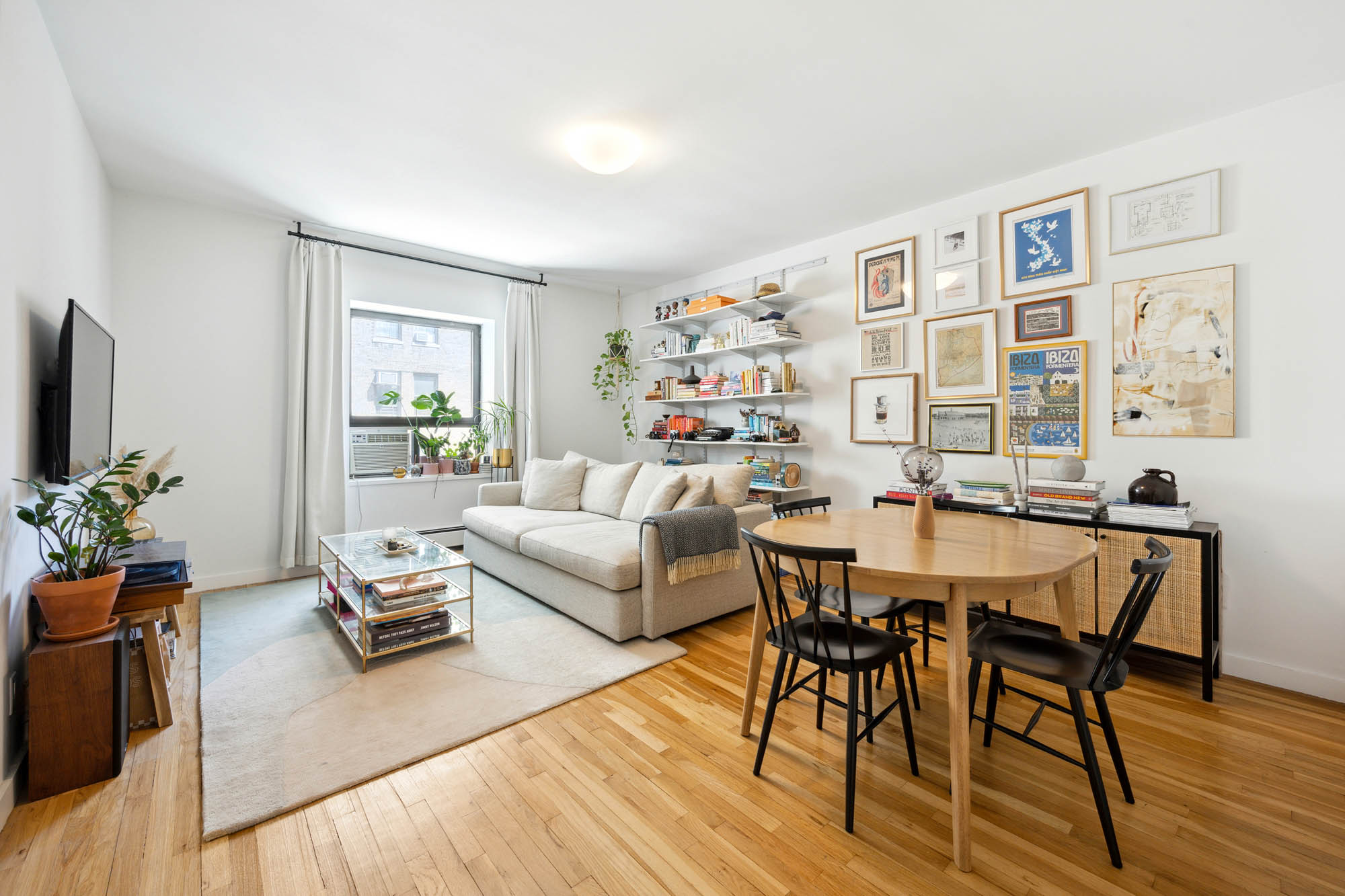 250 West 88th Street, Unit 703 Manhattan, NY 10024 - Photo 2 of 6 a living room with furniture and wooden floor