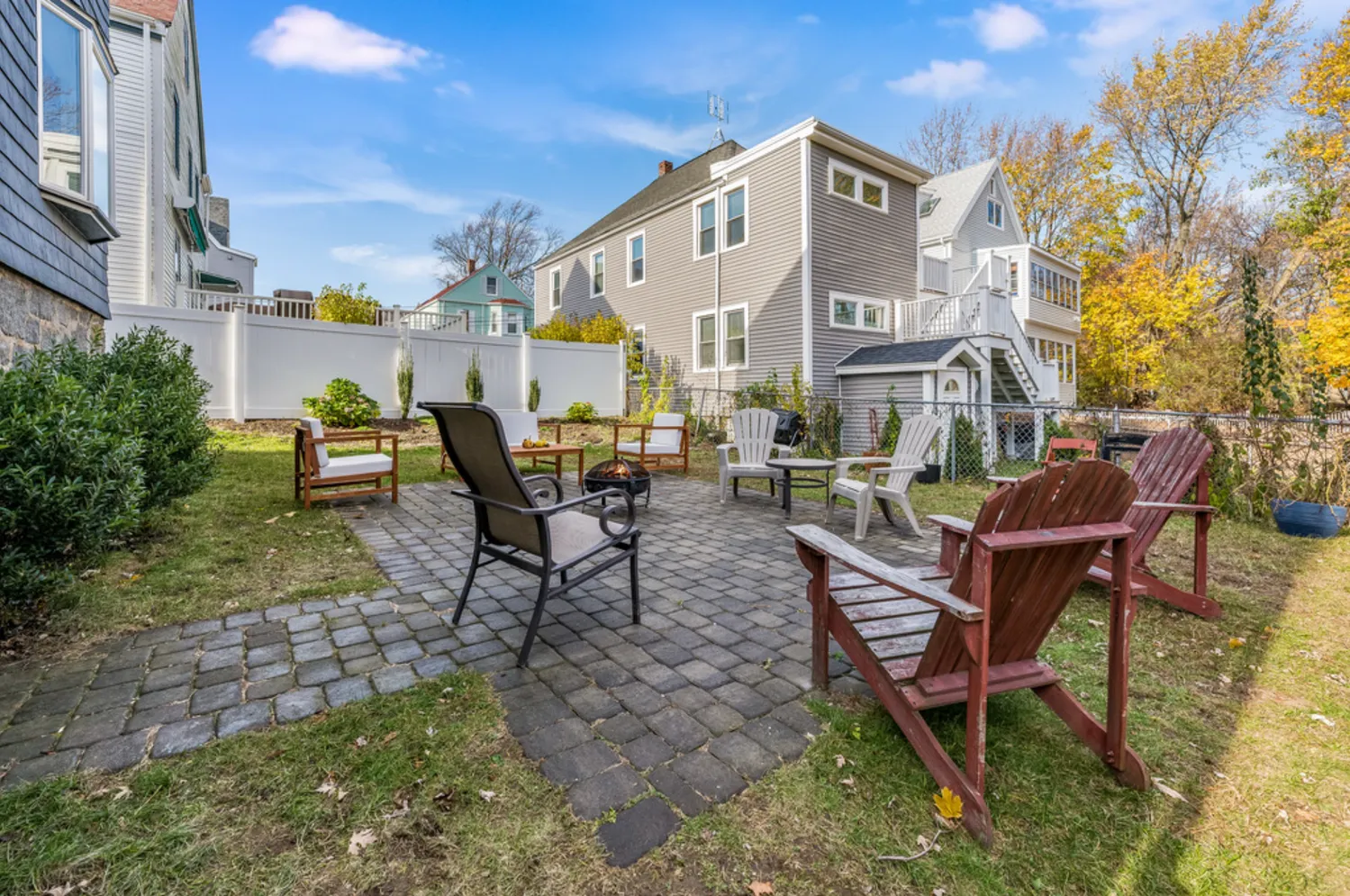 a view of a patio with table and chairs and potted plants