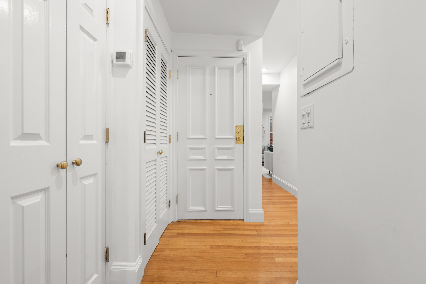 63 West Cedar Street, Unit 3 Boston, MA 02114 - Photo 14 of 17 a view of a hallway with wooden floor and staircase