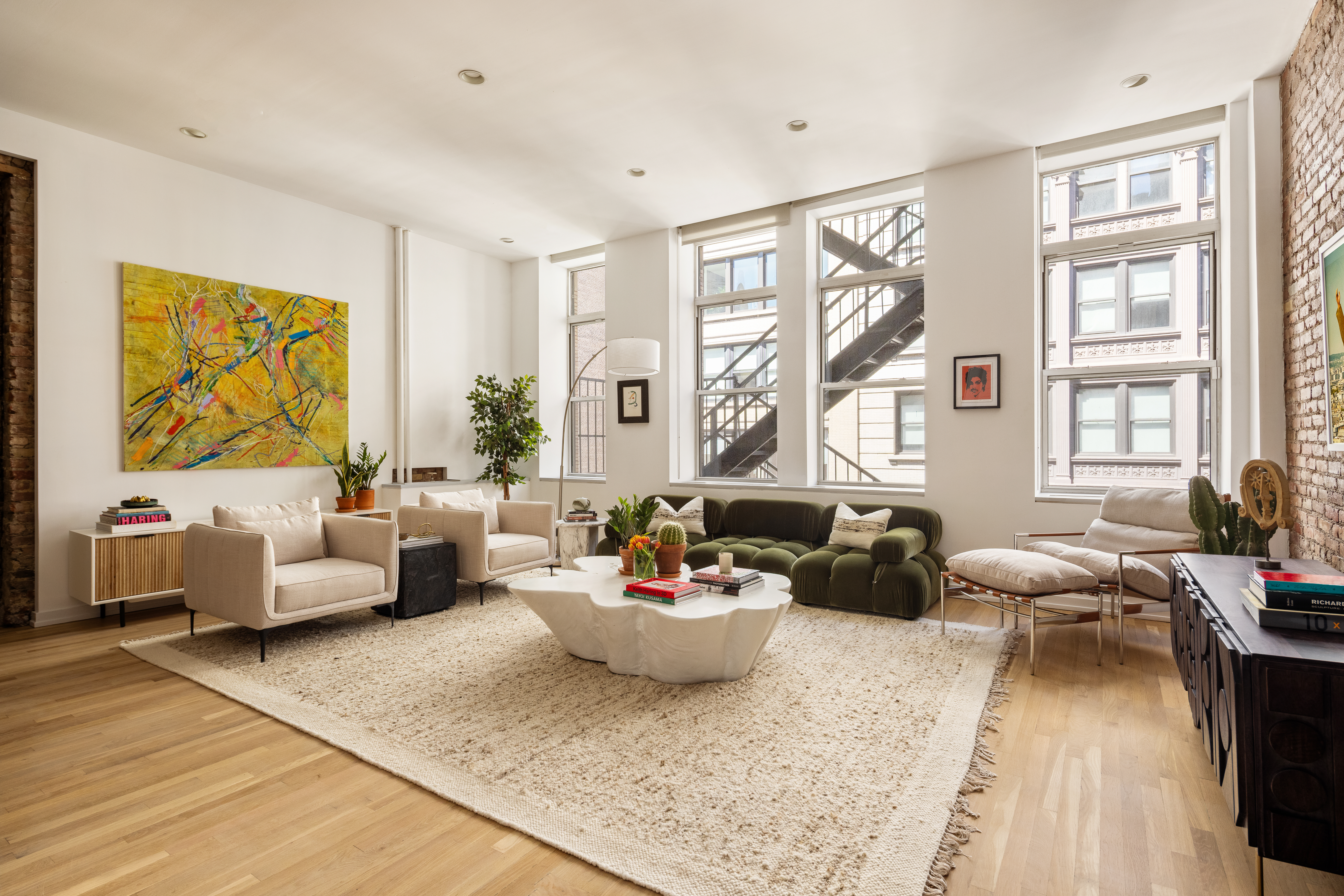 56 East 11th Street, Unit 5 Manhattan, NY 10003 - Photo 1 of 18 a living room with furniture and a large window