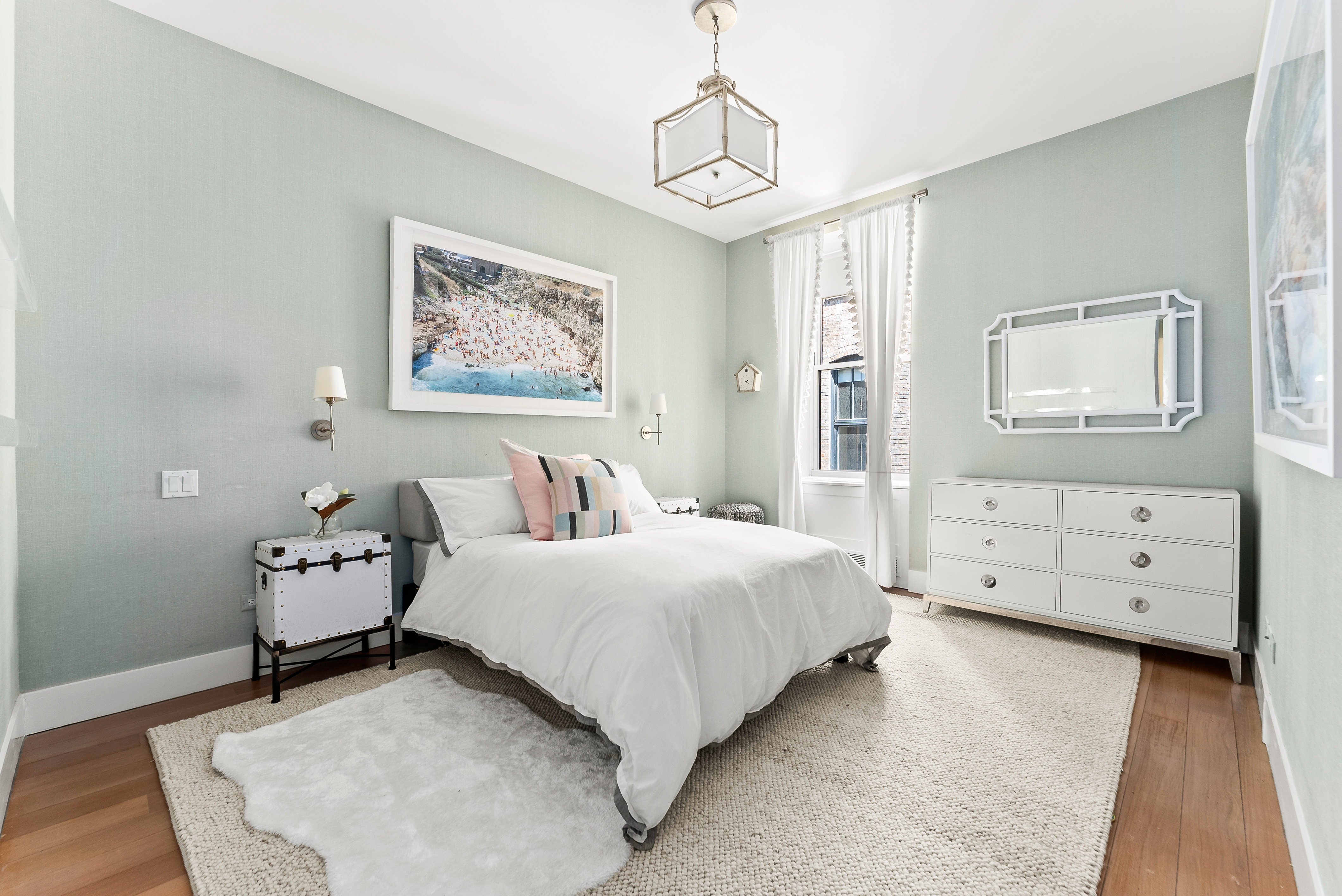 15 West 20th Street, Unit 9A Manhattan, NY 10011 - Photo 12 of 21 a bedroom with a bed and wooden floor