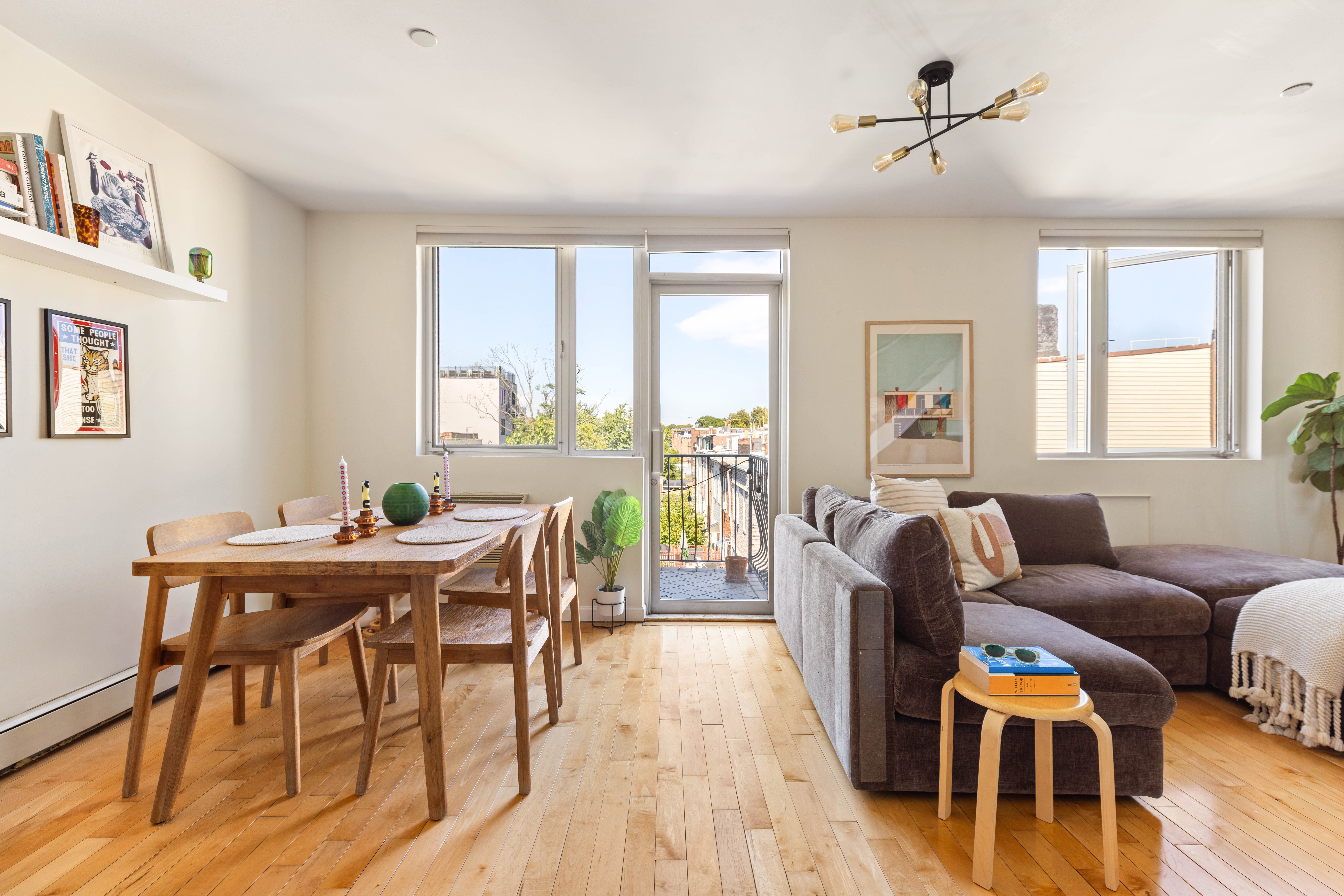 a workspace with furniture window and wooden floor
