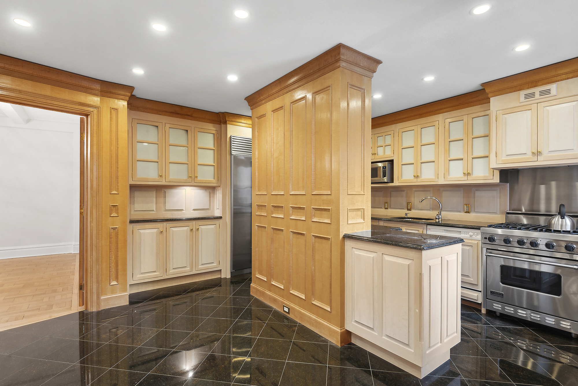 145 West 86th Street, Unit 12B Manhattan, NY 10024 - Photo 8 of 12 a kitchen with stainless steel appliances granite countertop a refrigerator a stove and a sink with granite countertops