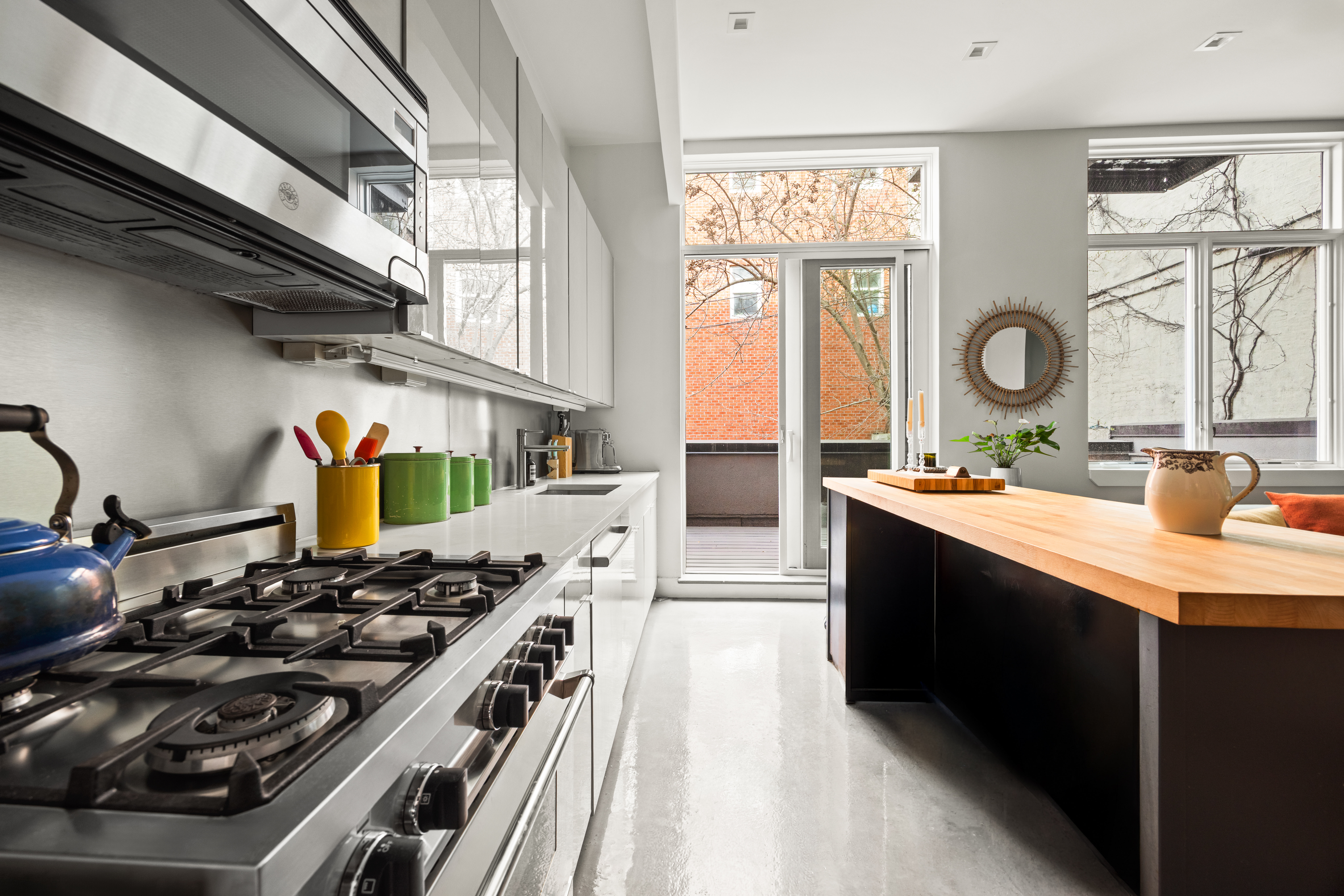 622 Grand Avenue, Unit 103 Brooklyn, NY 11238 - Photo 5 of 19 a kitchen with stainless steel appliances granite countertop a stove and a sink