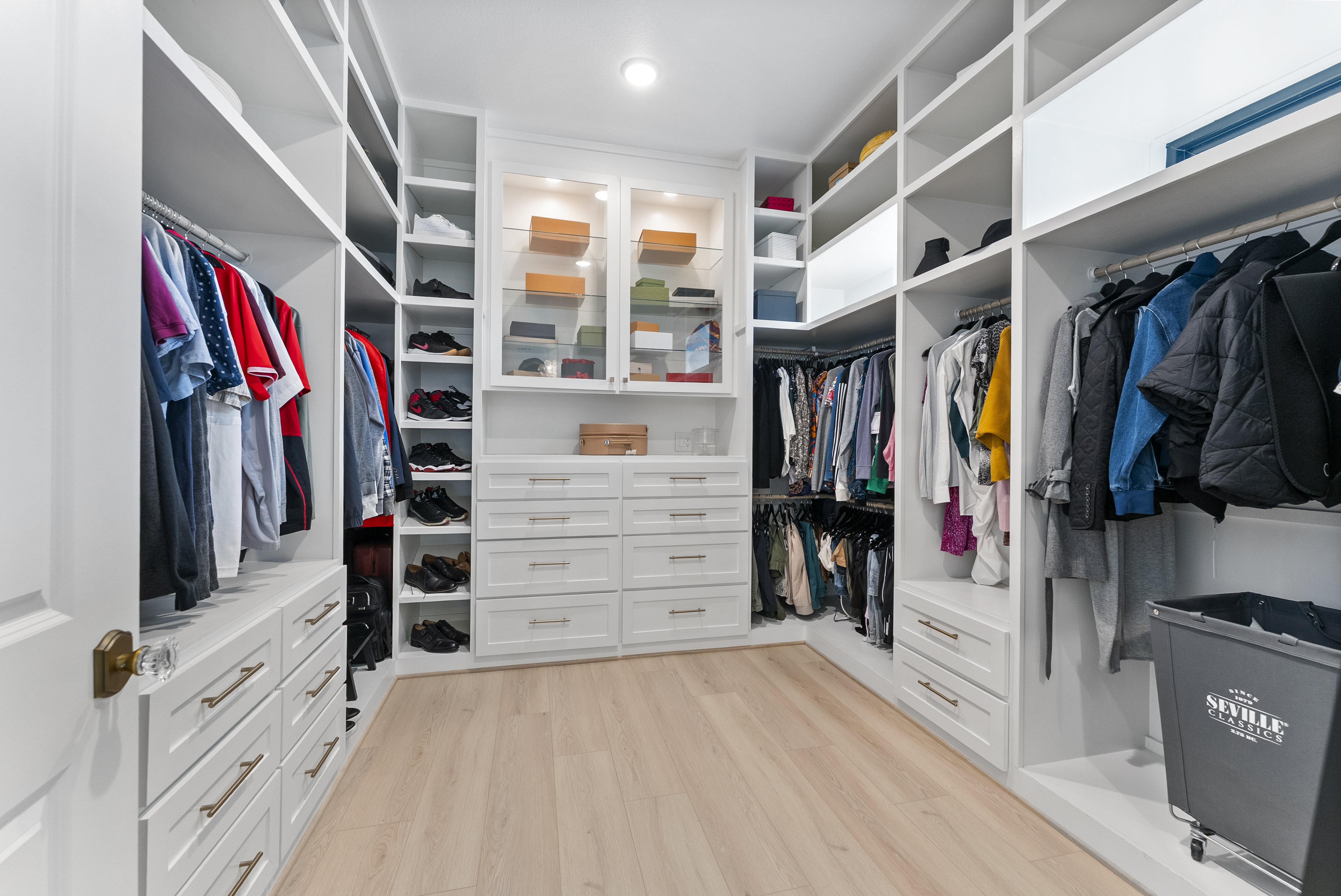 2118 Bennet Court Conroe, TX 77384 - Photo 34 of 70 a view of walk in closet with clothes and shoes