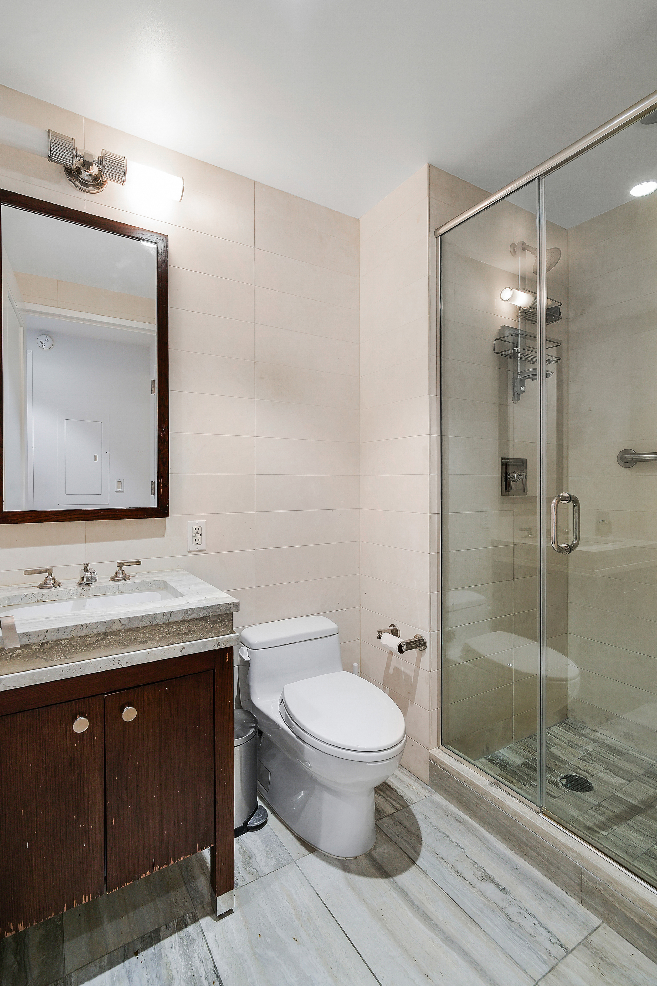 80 Riverside Boulevard, Unit 4H Manhattan, NY 10069 - Photo 6 of 17 a bathroom with a toilet sink and shower