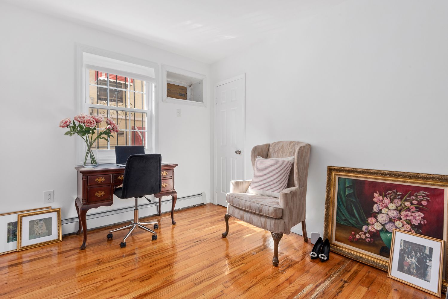 756 Barbey Street, Unit 1A Brooklyn, NY 11207 - Photo 5 of 9 a living room with furniture and a painting on the wall