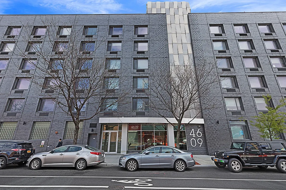 46-09 11th Street, Unit 4H Queens, NY 11101 - Photo 12 of 13 a car parked in front of a building