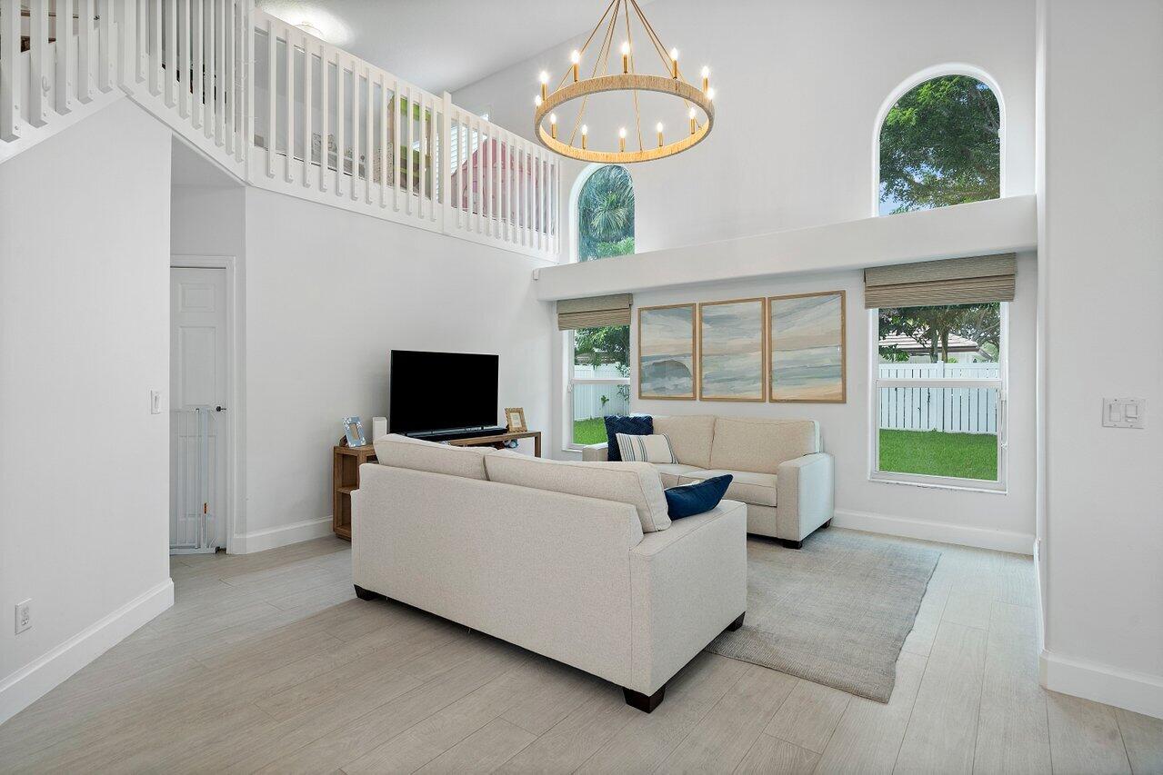 1182 Canoe Point Delray Beach, FL 33444 - Photo 8 of 46 a living room with furniture and a flat screen tv