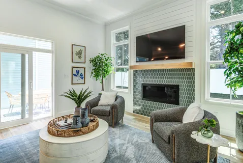 a living room with furniture and a fireplace
