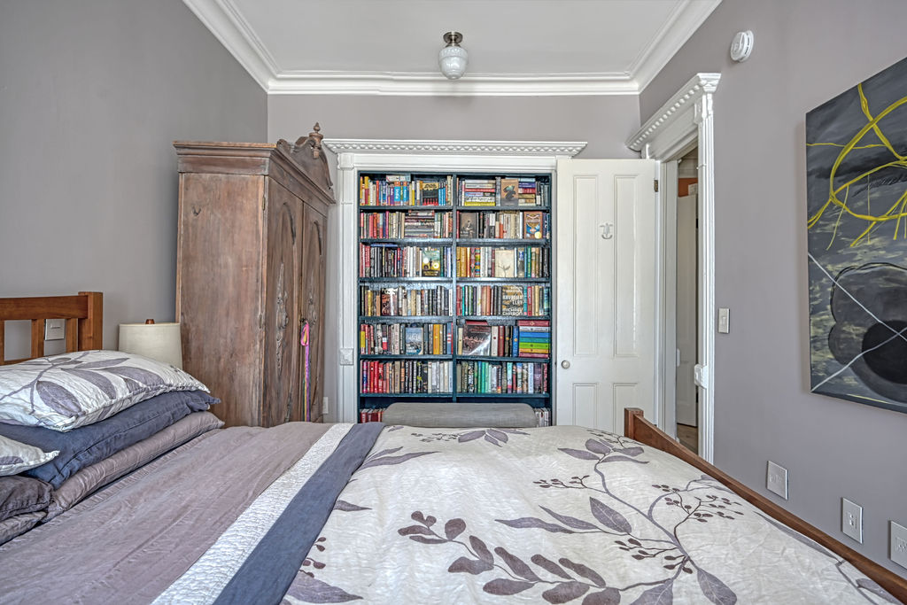 315 15th Street Brooklyn, NY 11215 - Photo 14 of 25 a bedroom with a large bed and a window