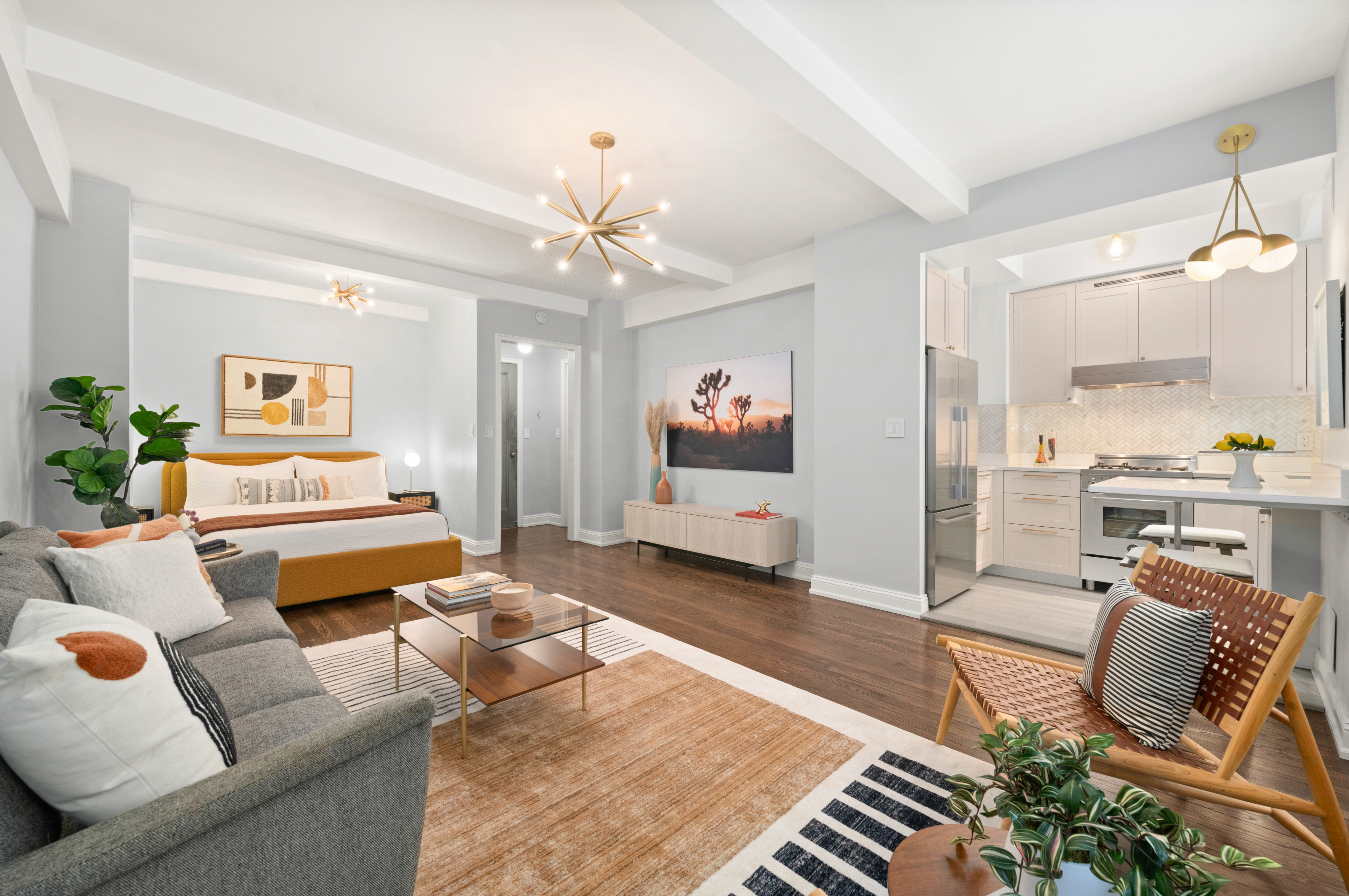 465 West 23rd Street, Unit 2G Manhattan, NY 10011 - Photo 3 of 11 a living room with furniture and a chandelier
