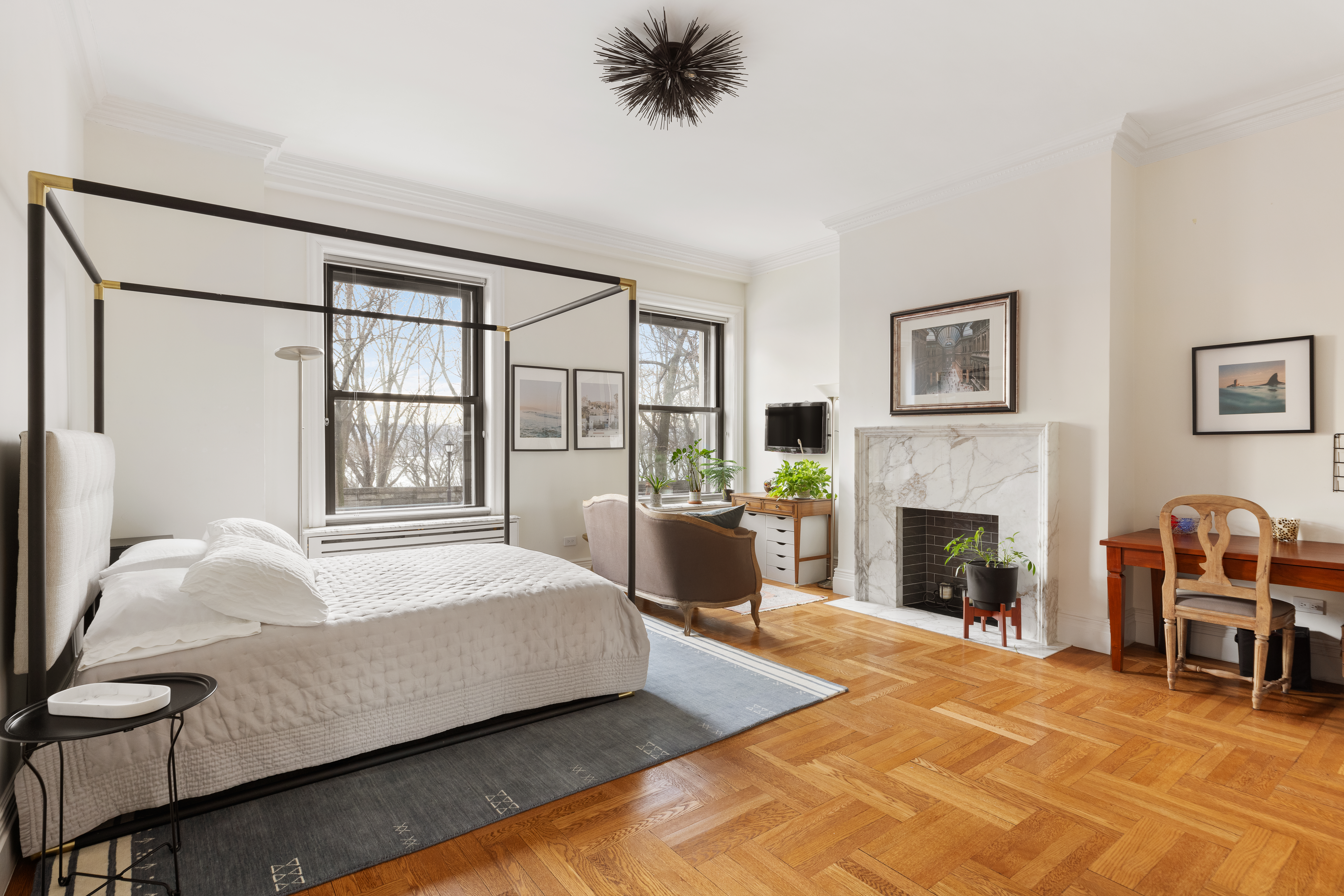 137 Riverside Drive, Unit 2D Manhattan, NY 10024 - Photo 14 of 20 a spacious bedroom with a bed and a fireplace