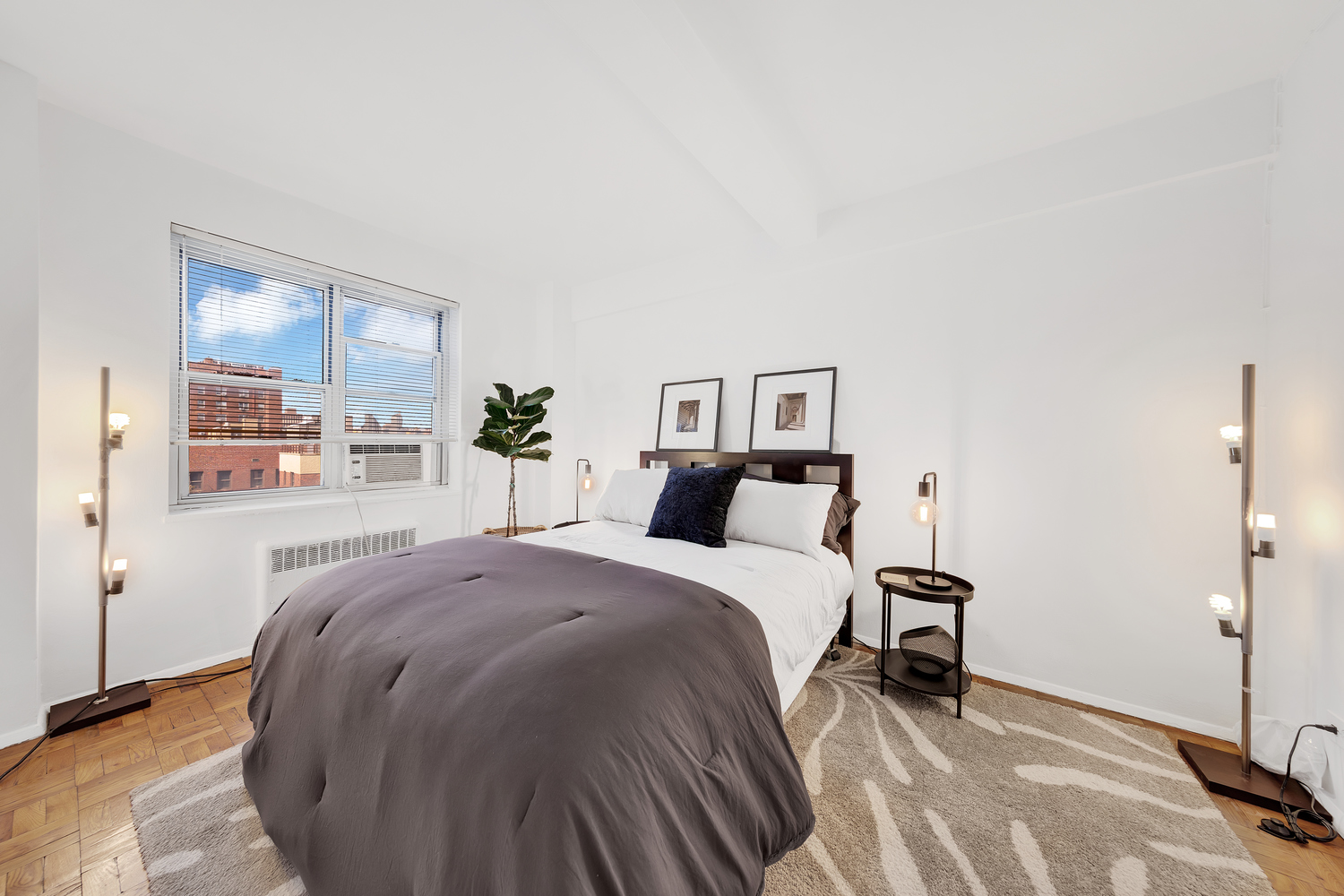 530 Grand Street, Unit E8C Manhattan, NY 10002 - Photo 4 of 15 a spacious bedroom with a bed and a cabinets