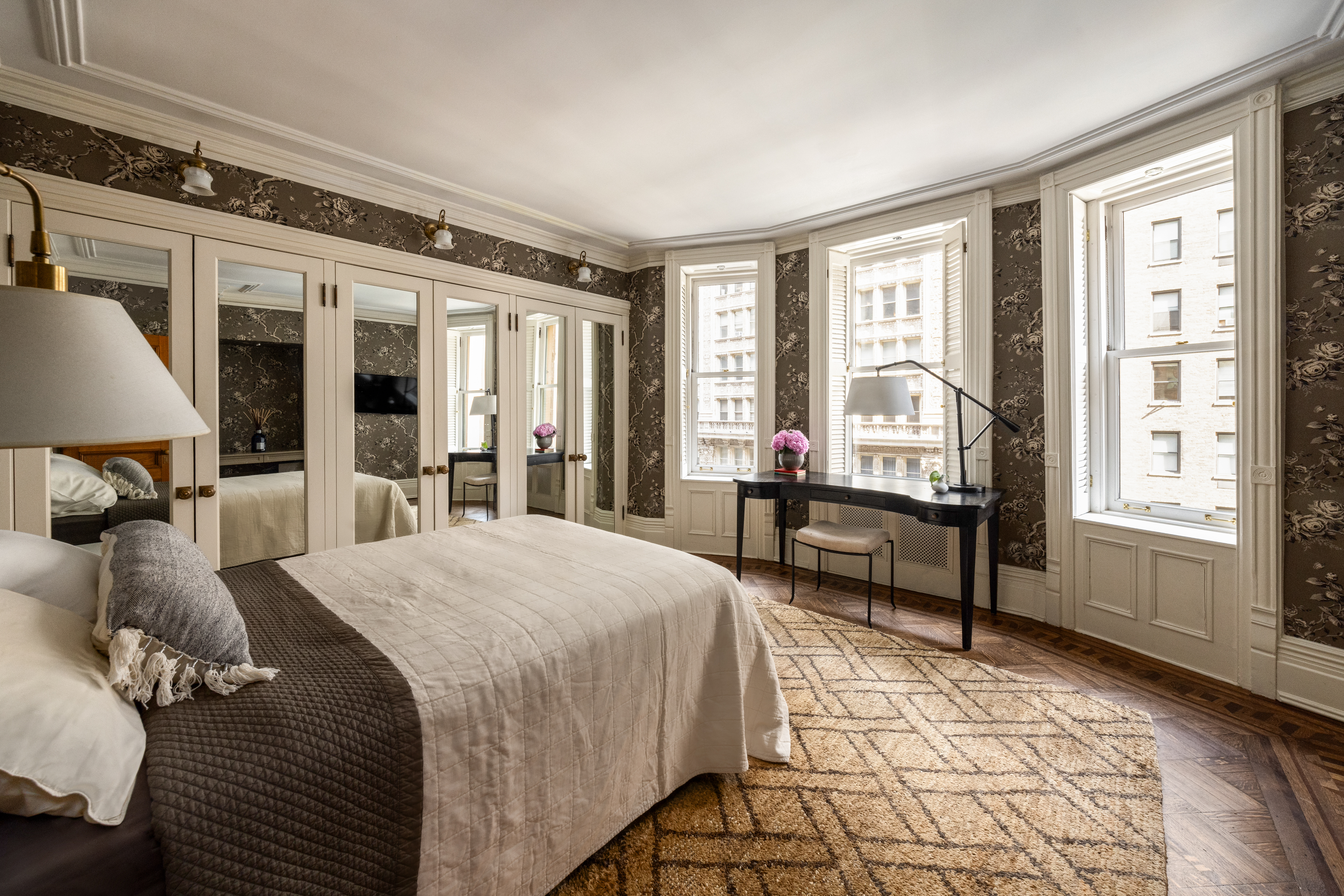 205 West 57th Street, Unit 4B Manhattan, NY 10019 - Photo 12 of 14 a bedroom with a bed and wooden floor