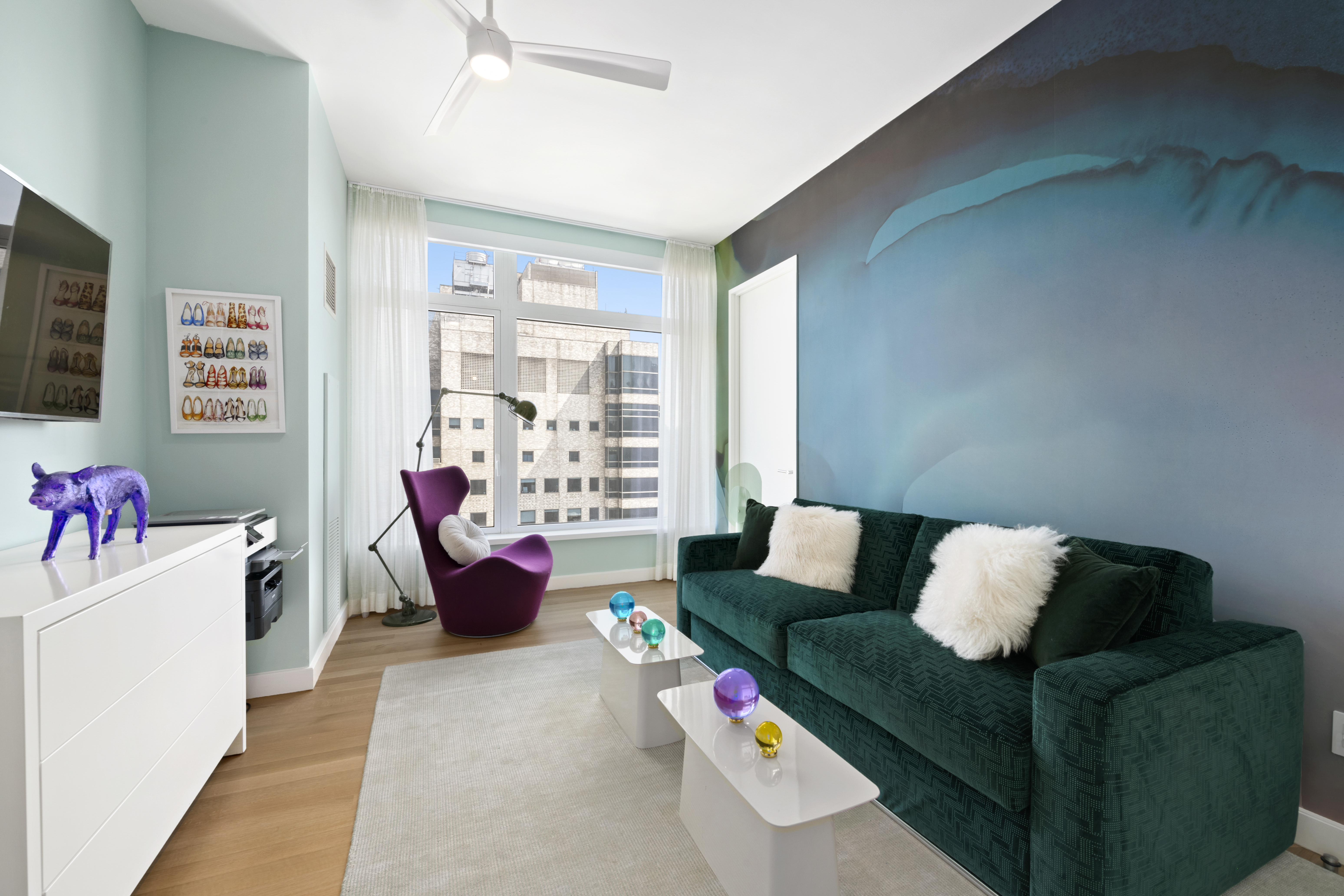 400 East 67th Street, Unit 19D Manhattan, NY 10065 - Photo 6 of 9 a living room with furniture and a flat screen tv