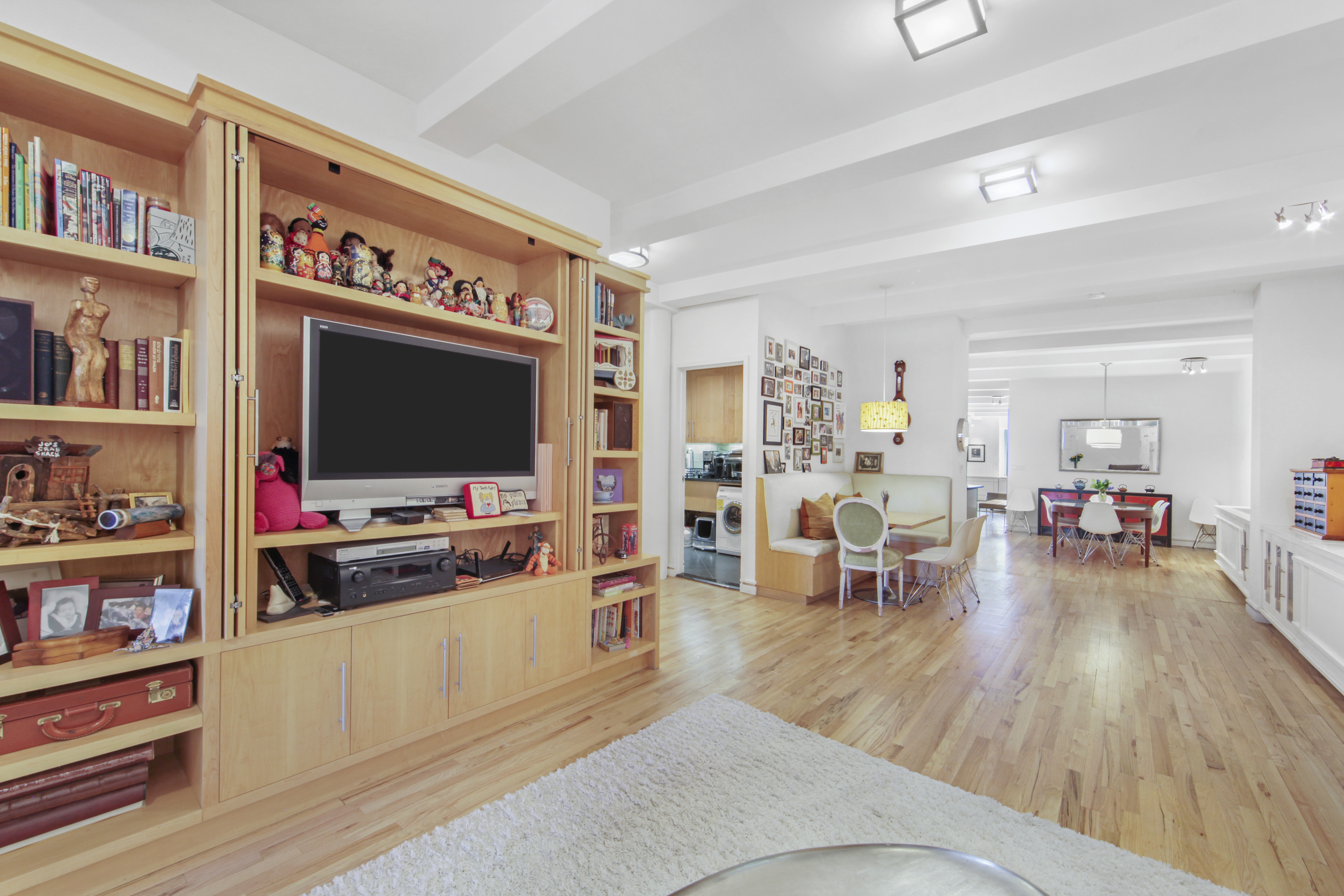 18 East 12th Street, Unit 7BC Manhattan, NY 10003 - Photo 24 of 26 a living room with furniture and a flat screen tv