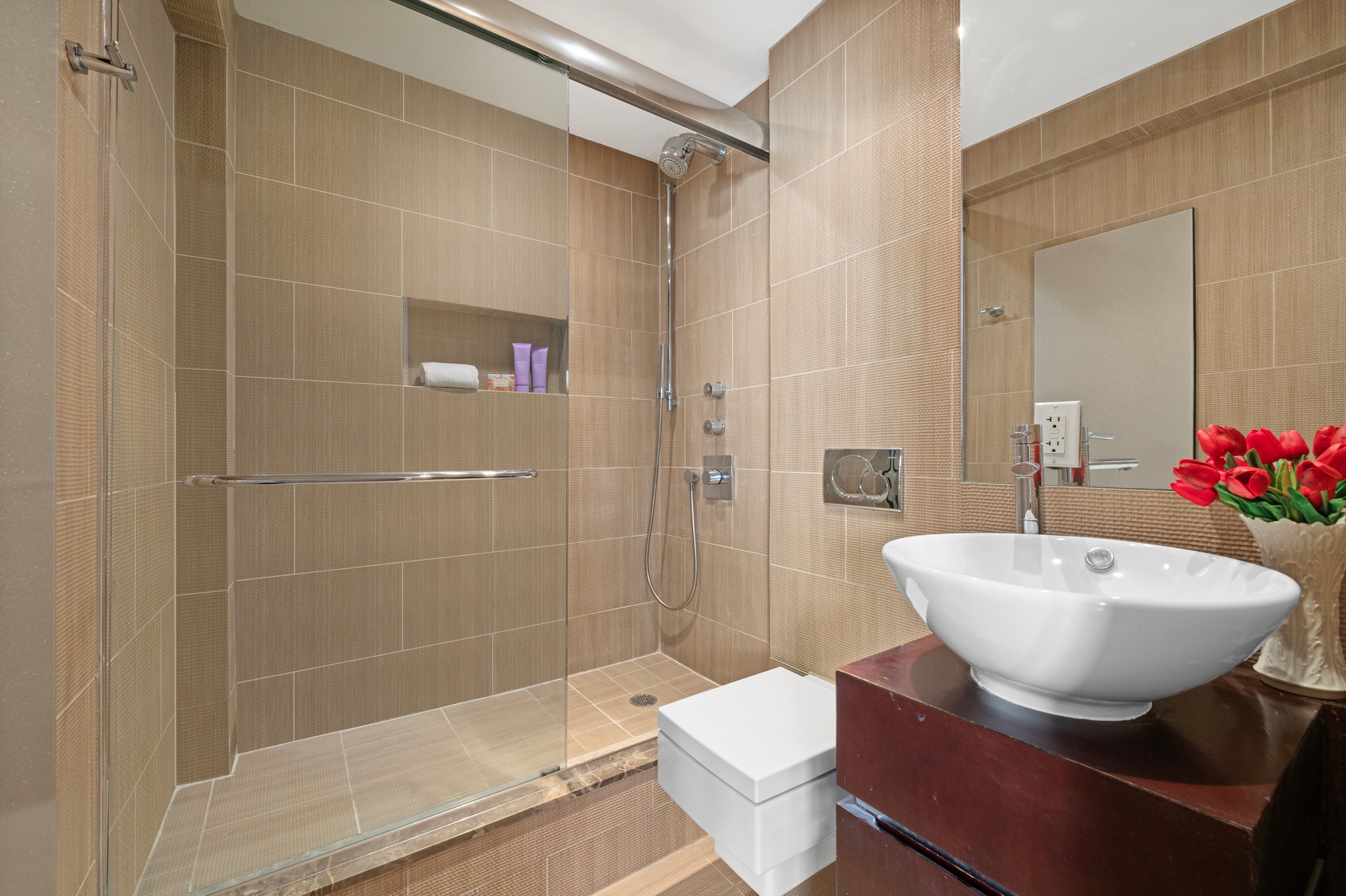 40 East 9th Street, Unit 6M Manhattan, NY 10003 - Photo 13 of 22 a bathroom with a sink toilet a mirror and shower