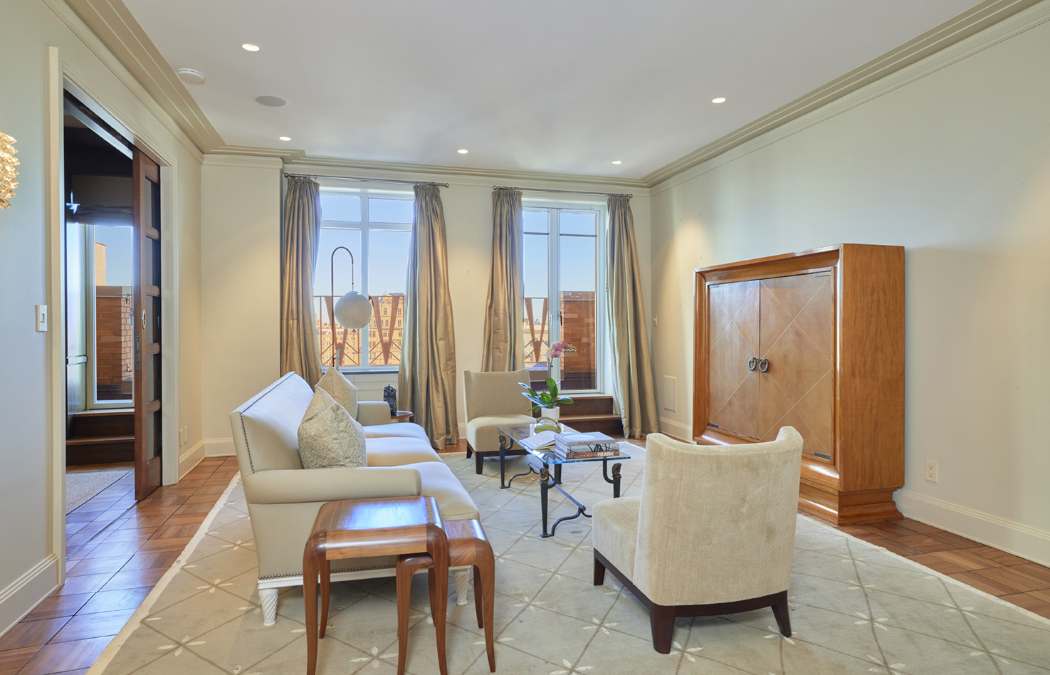 115 Central Park West, Unit 18JK Manhattan, NY 10023 - Photo 2 of 25 a living room with furniture and wooden floor
