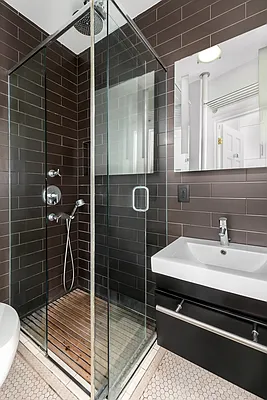 13 Downing Street, Unit 8 Manhattan, NY 10014 - Photo 8 of 10 a bathroom with a shower