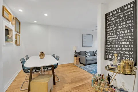a living room with furniture and a chair