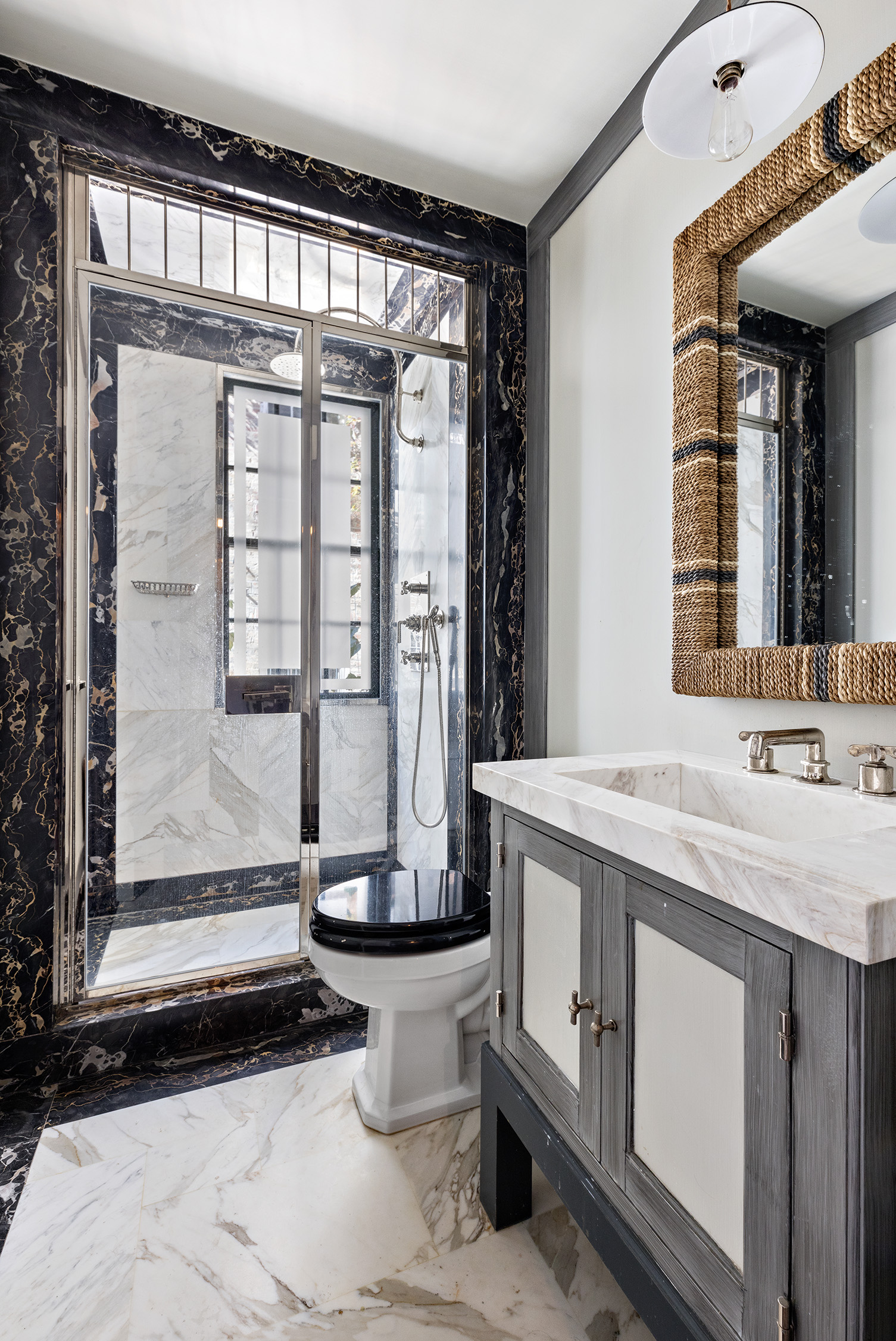 68 Morton Street Manhattan, NY 10014 - Photo 18 of 21 a bathroom with a granite countertop sink and a mirror