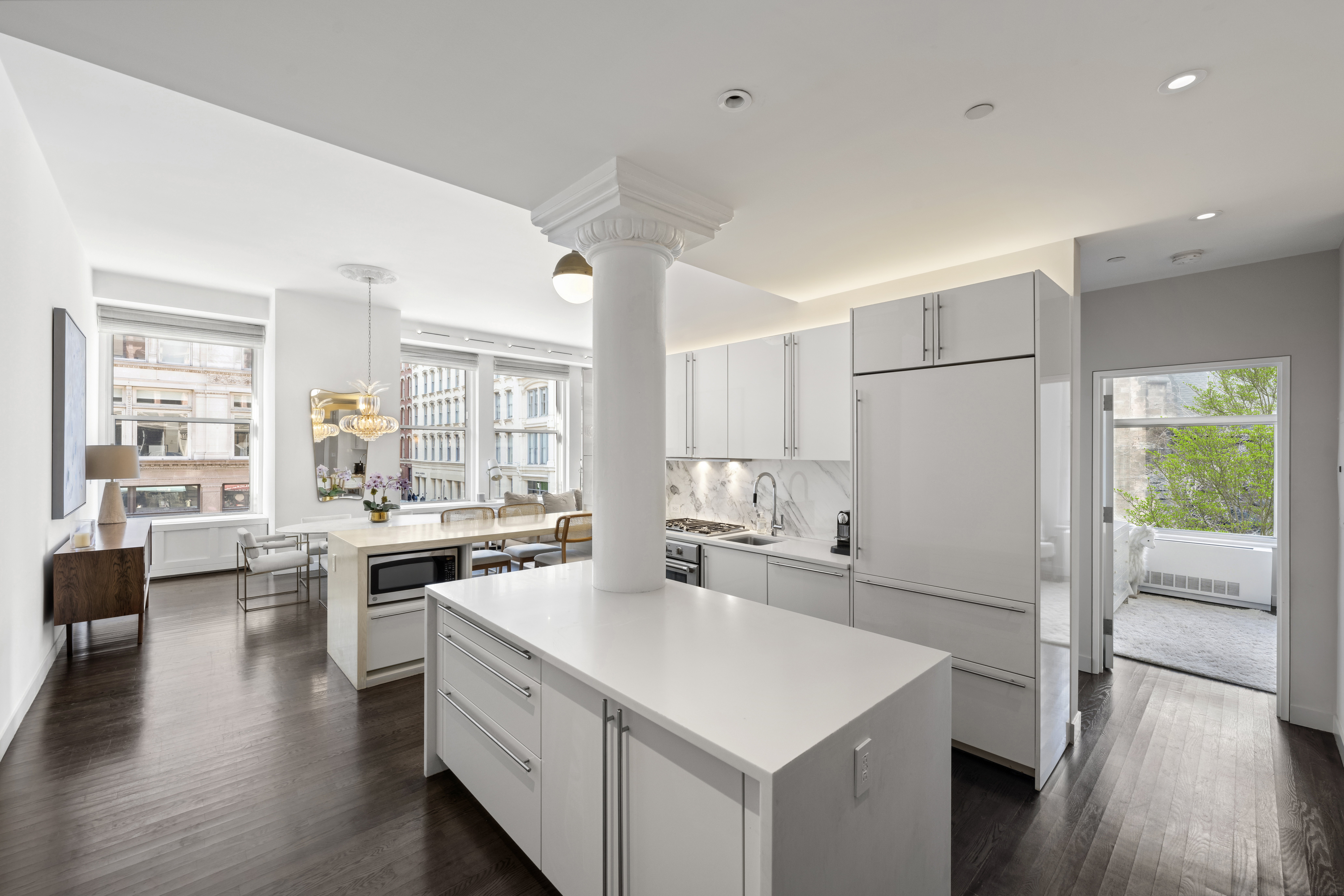 60 West 20th Street, Unit 2F Manhattan, NY 10011 - Photo 8 of 21 a kitchen with a stove a refrigerator and a stove with wooden floors