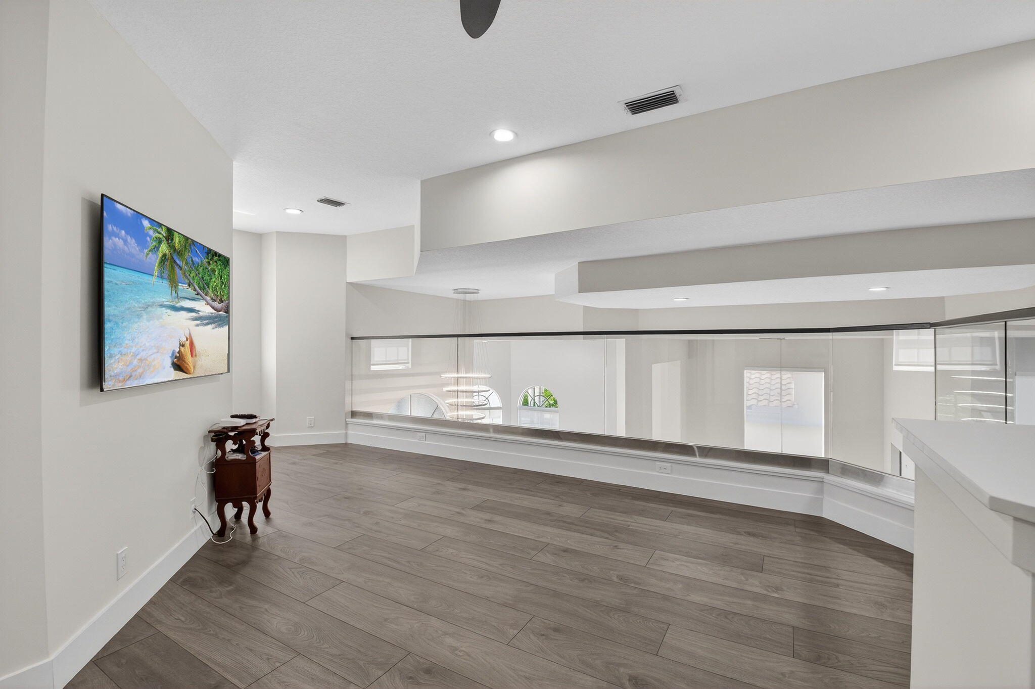 6529 Somerset Circle Boca Raton, FL 33496 - Photo 35 of 75 a view of empty room with wooden floor and fan