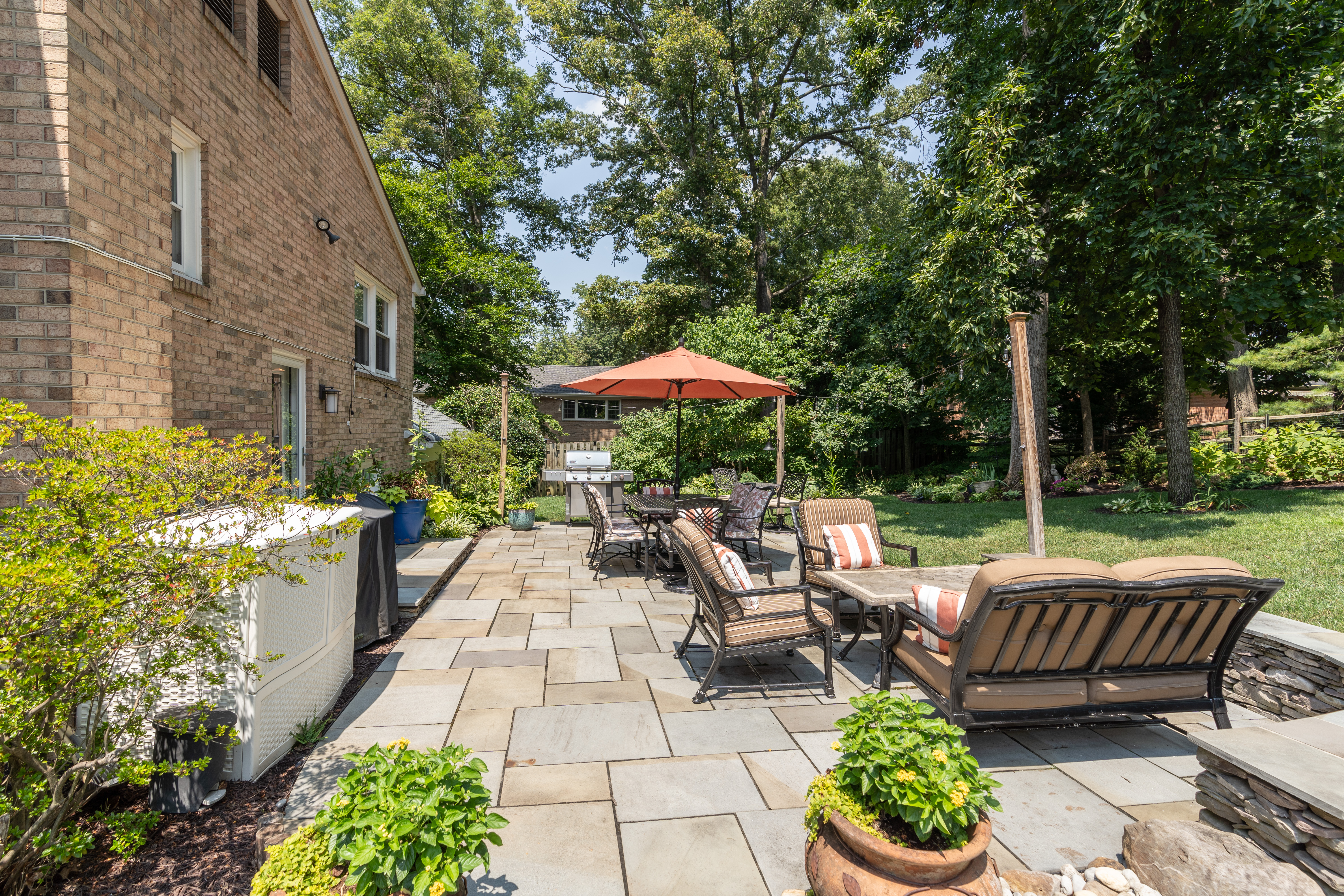 7303 Fort Hunt Road Alexandria, VA 22307 - Photo 9 of 11 a view of a patio with furniture and a garden