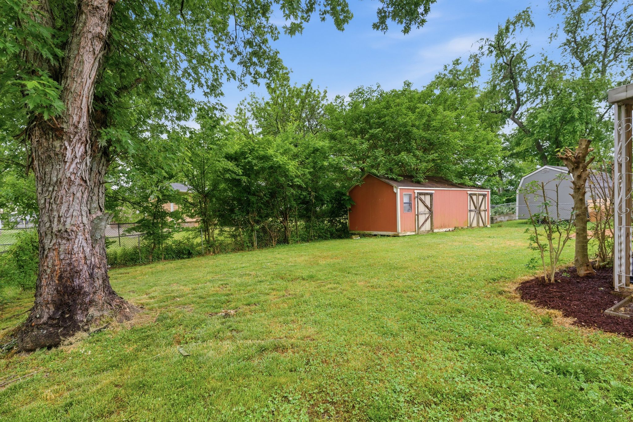 307 Paragon Mills Road Nashville, TN 37211 - Photo 27 of 29 a backyard of a house with lots of green space