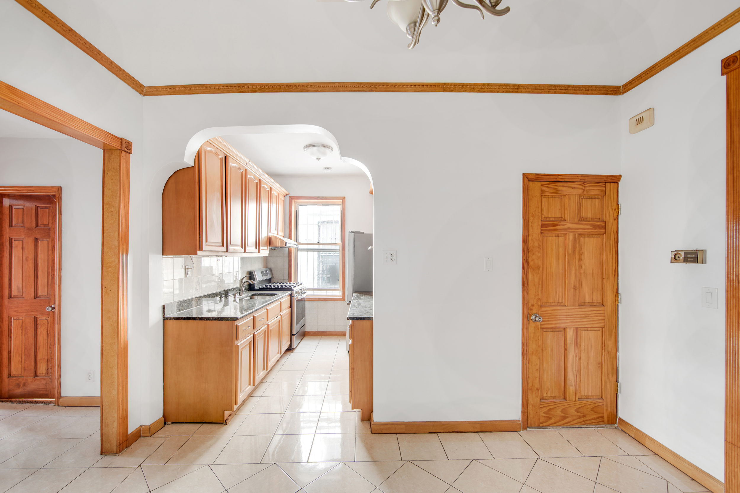 1759 West 1st Street Brooklyn, NY 11223 - Photo 9 of 21 a large bathroom with a glass door shower and a sink
