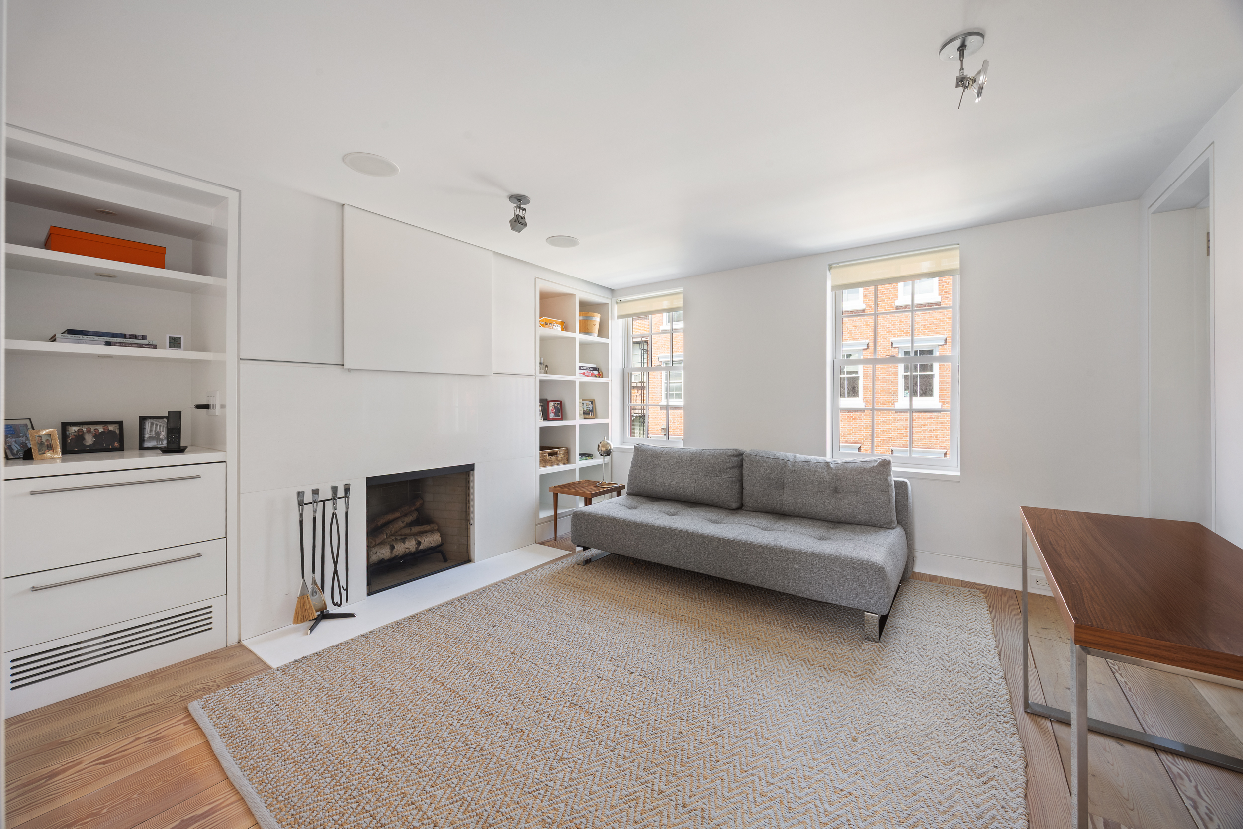39 Barrow Street Manhattan, NY 10014 - Photo 19 of 39 a living room with furniture and a fireplace