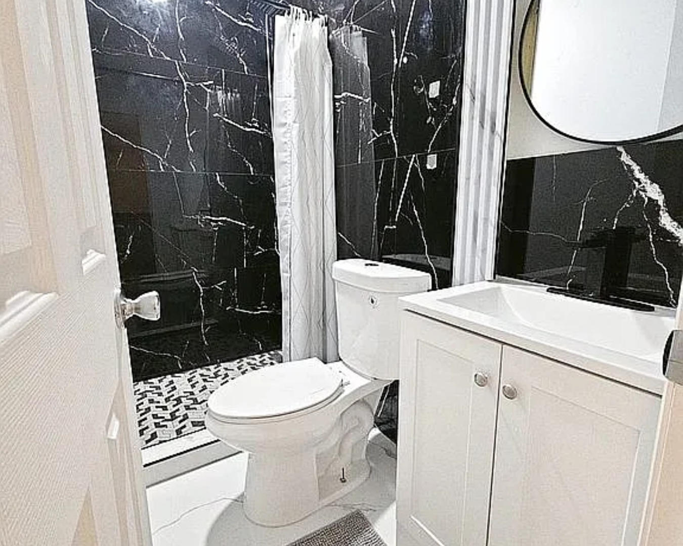 2822 Pine Tree Drive Miami Beach, FL 33140 - Photo 20 of 21 a bathroom with a toilet and a sink