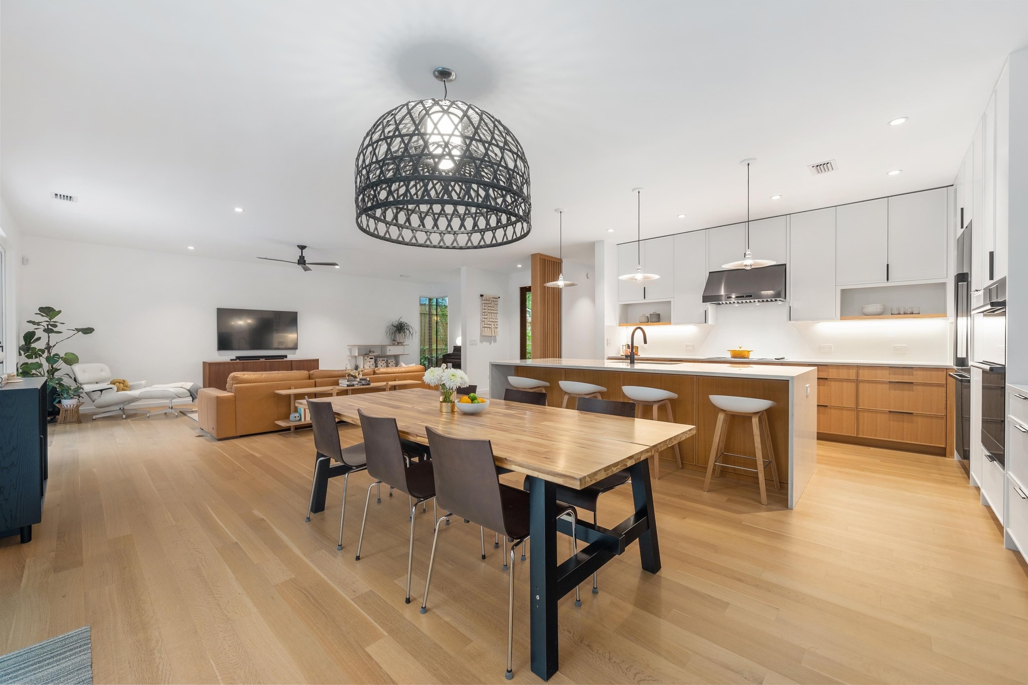 1206 Bickler Road Austin, TX 78704 - Photo 25 of 65 a living room with lots of furniture and a chandelier