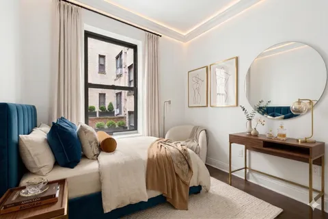 a bedroom with bed and window
