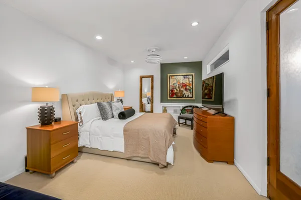 a bed room with a bed and a couch