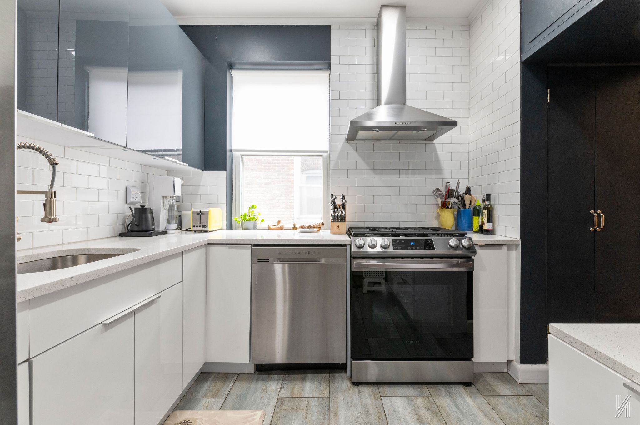 34-39 82nd Street, Unit 52 Queens, NY 11372 - Photo 6 of 18 a kitchen with a stove and a sink