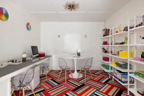 a very nice looking room with furniture and a rug