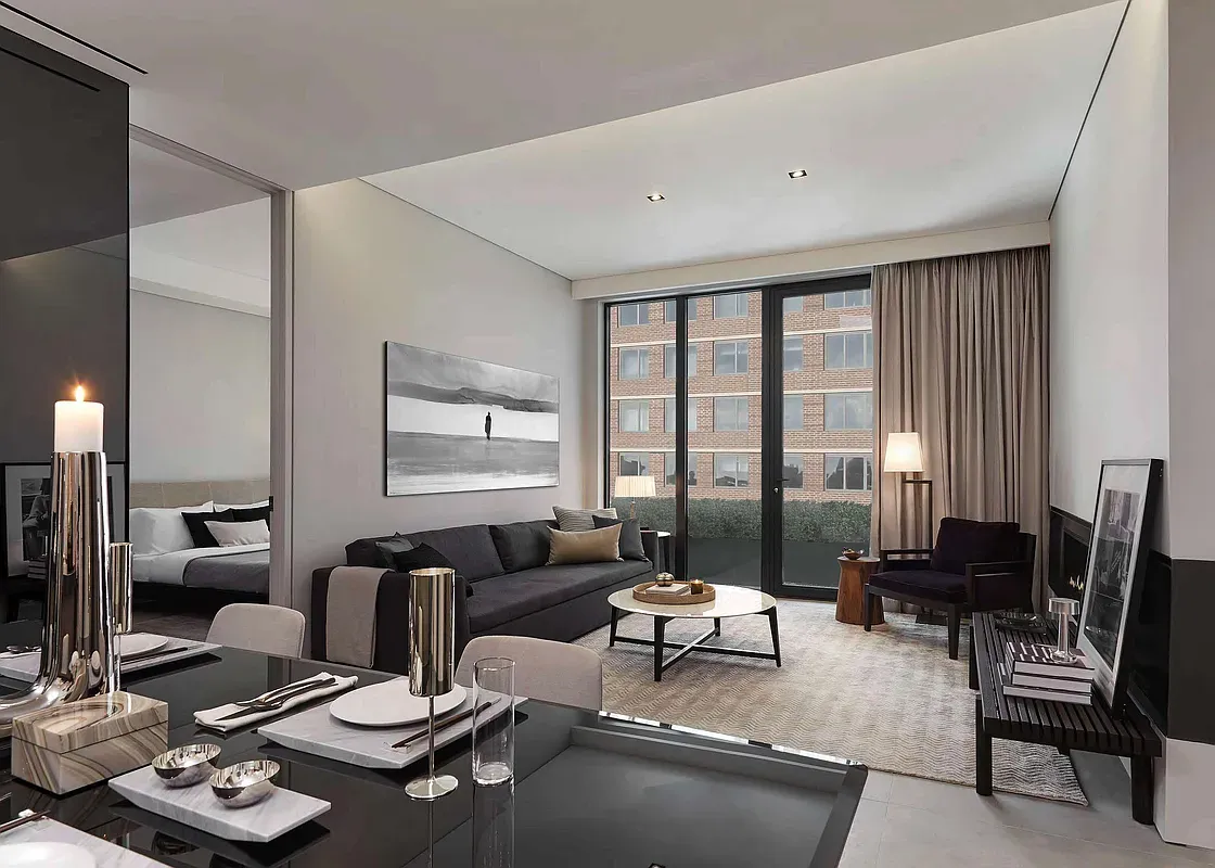 a living room with furniture and floor to ceiling window