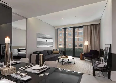 a living room with furniture and floor to ceiling window